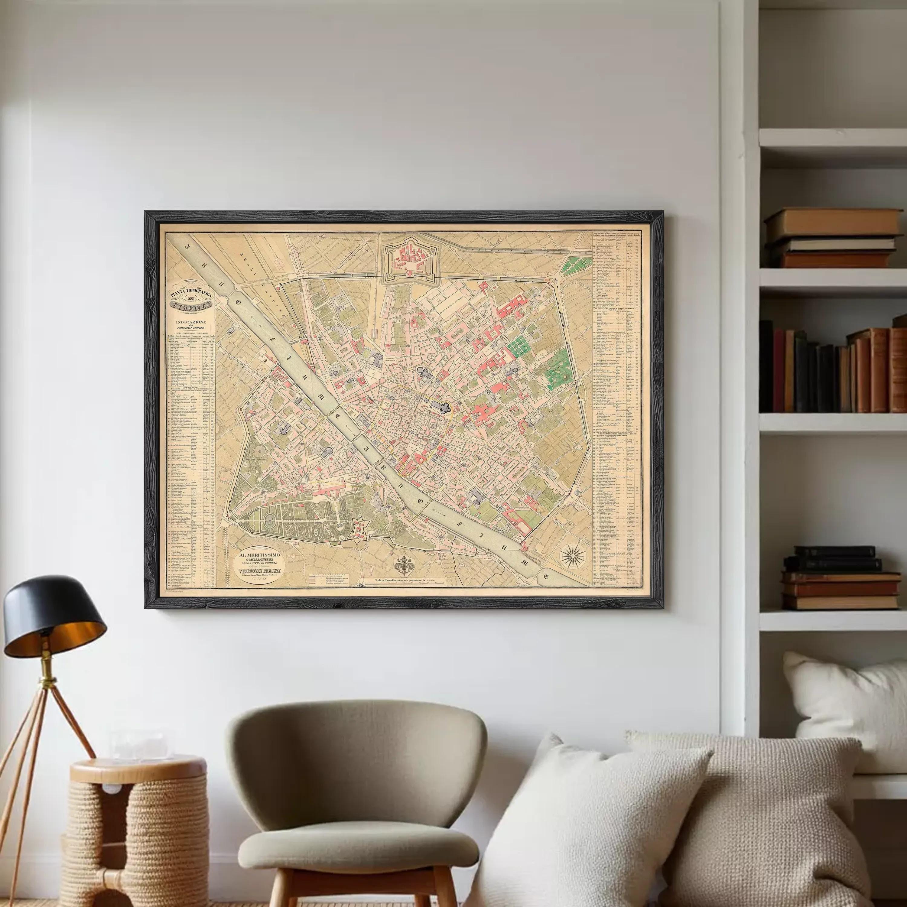 The image is a framed vintage map of a city, likely from the 19th century, displayed on a white wall.