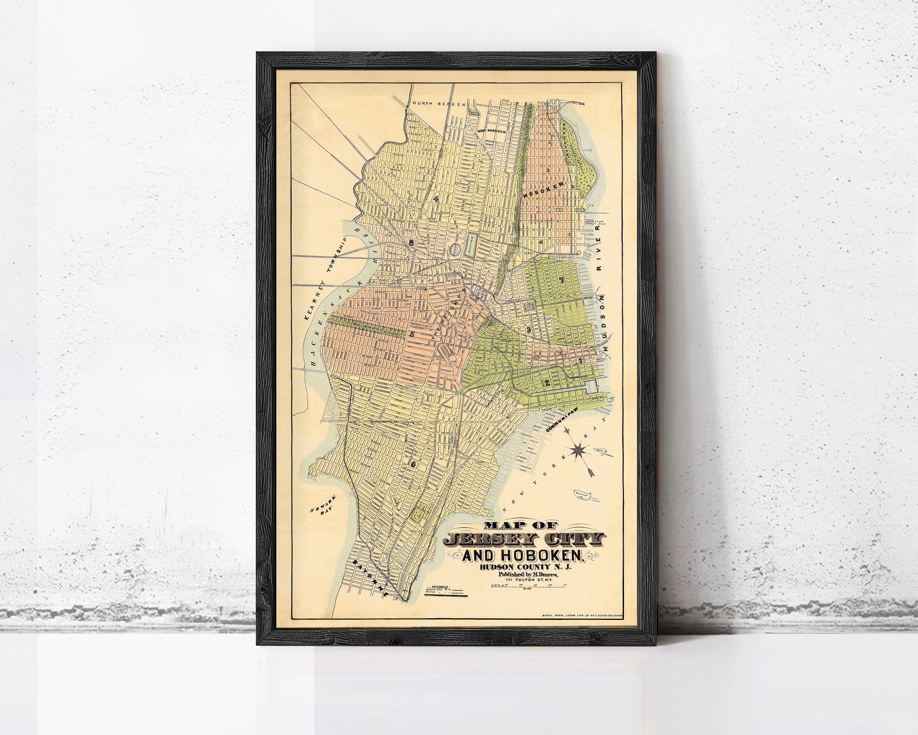 The image is a framed map of Jersey City, New Jersey, depicting the city's layout and surrounding areas.