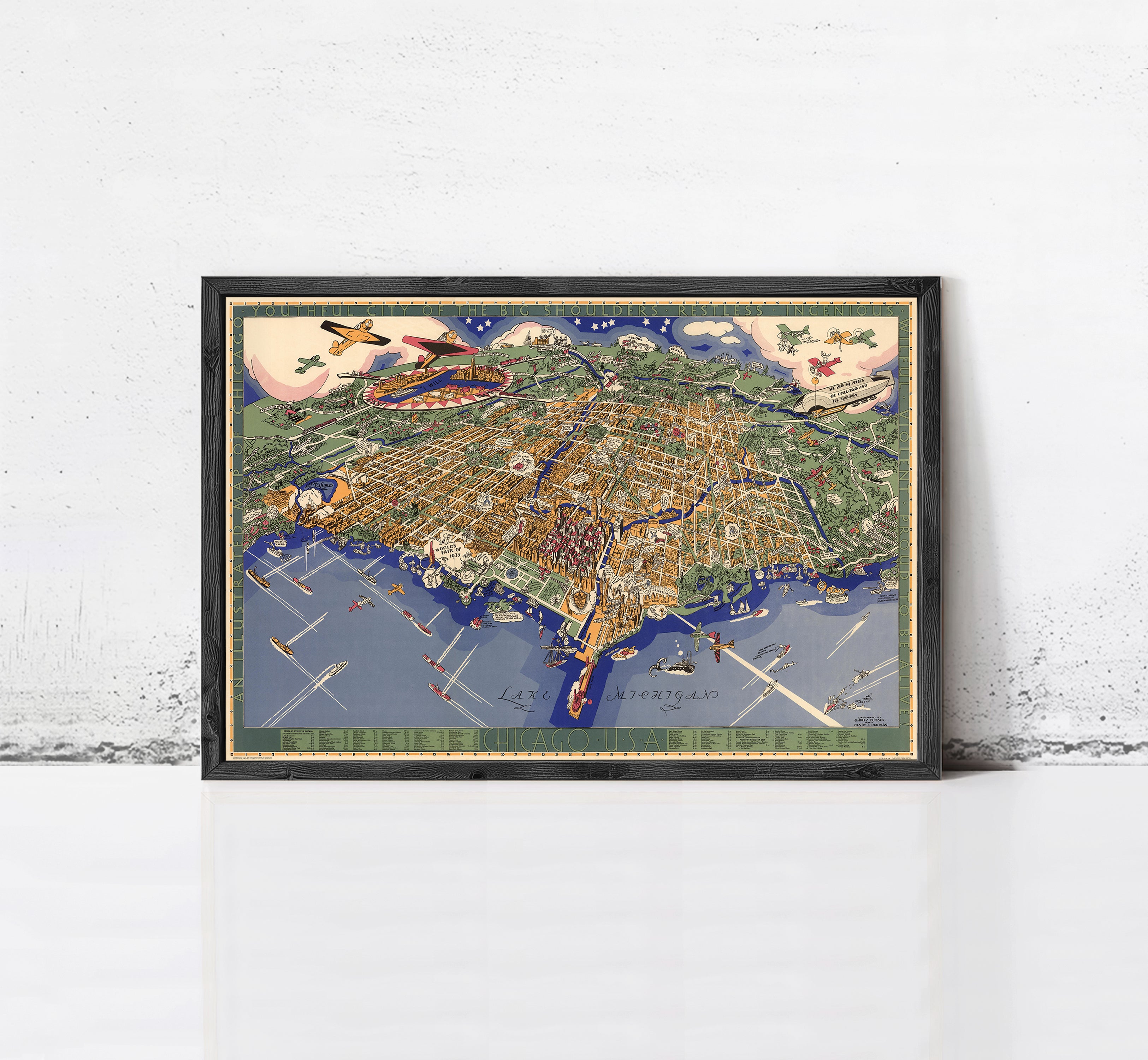 The image is a framed vintage map of a city, depicting various landmarks and streets.
