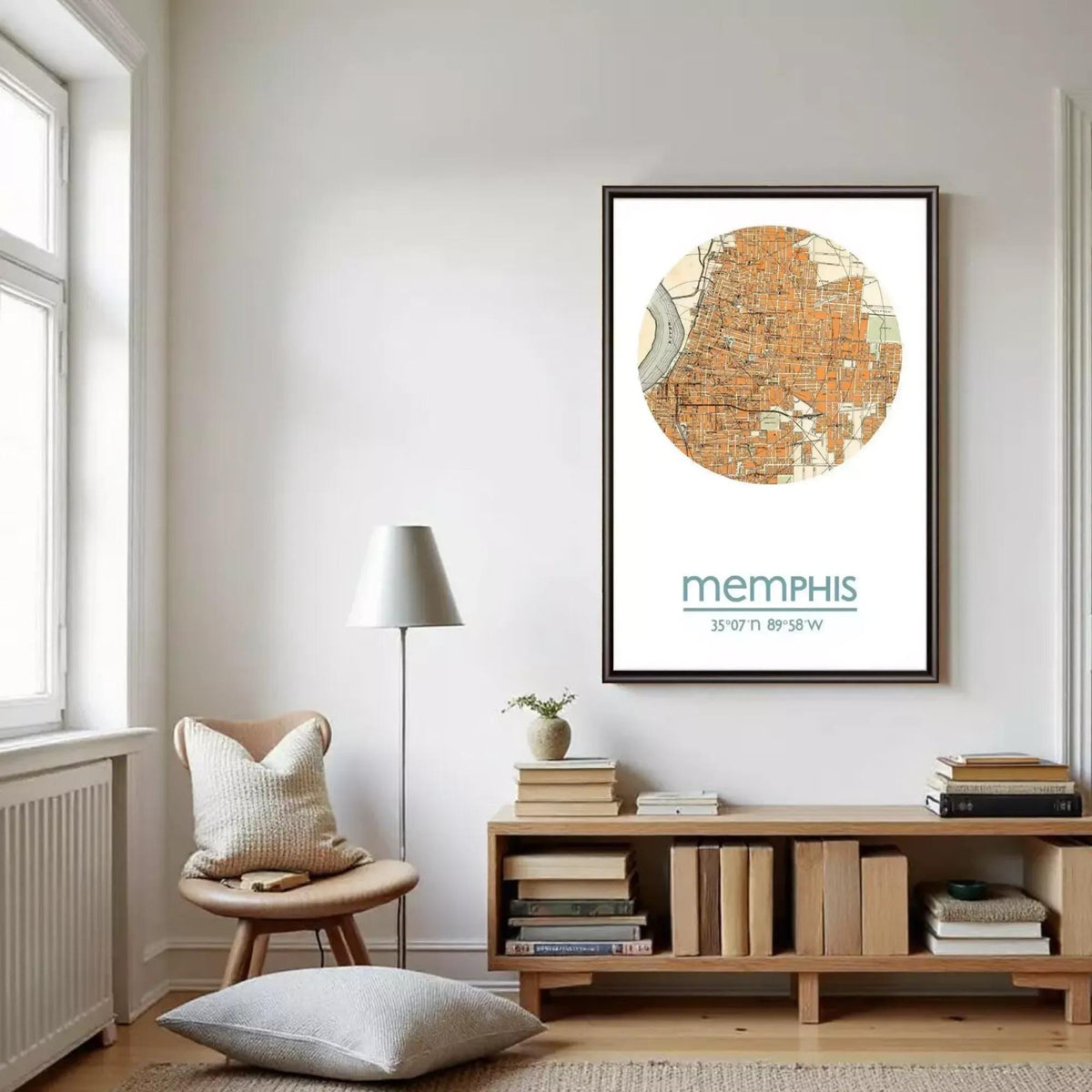 a cozy living room with a large framed map of Memphis hanging on the wall. The room has a wooden bookshelf filled with books, a comfortable chair, and a lamp providing soft lighting.