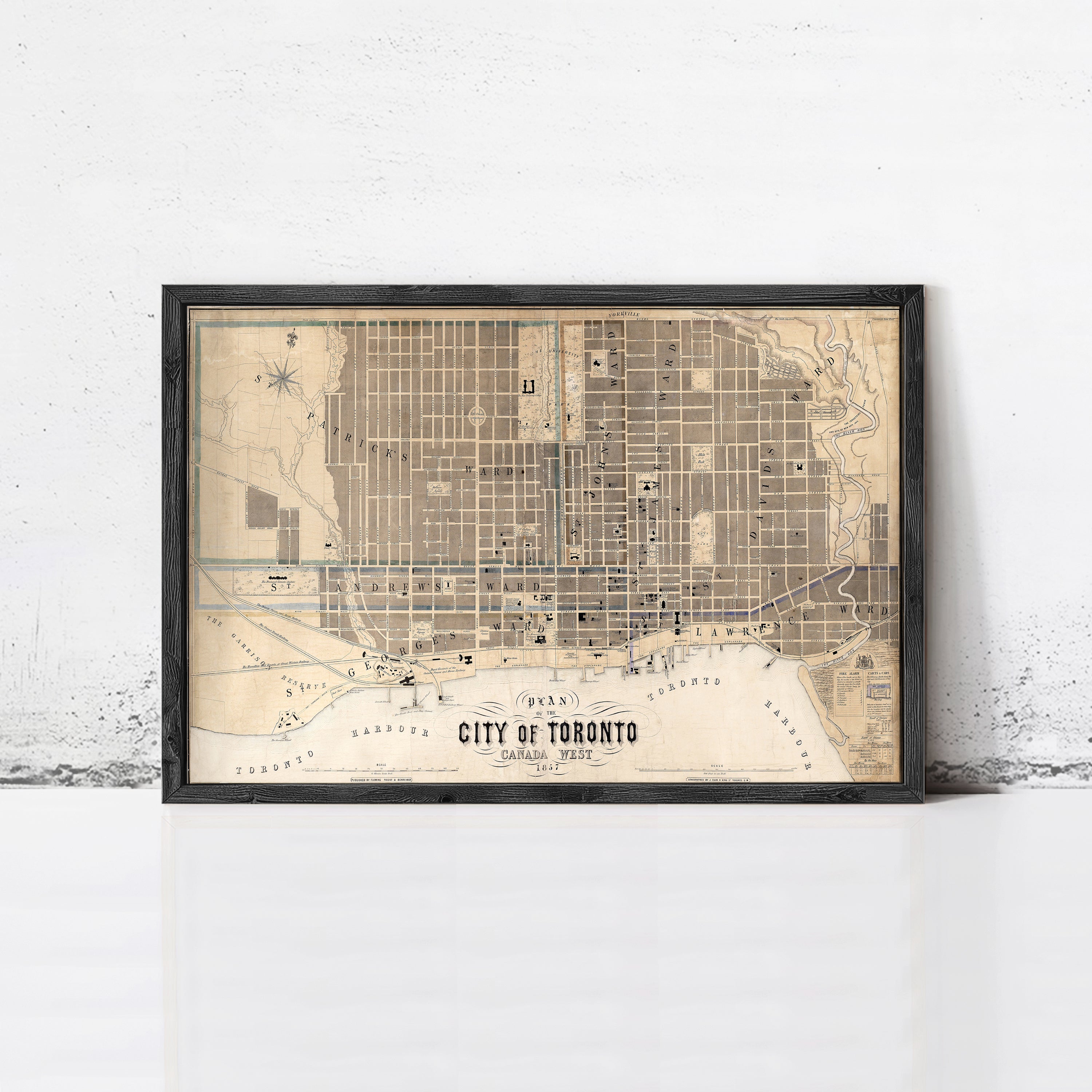 A framed map of Toronto, Canada, depicting the city's streets and landmarks.