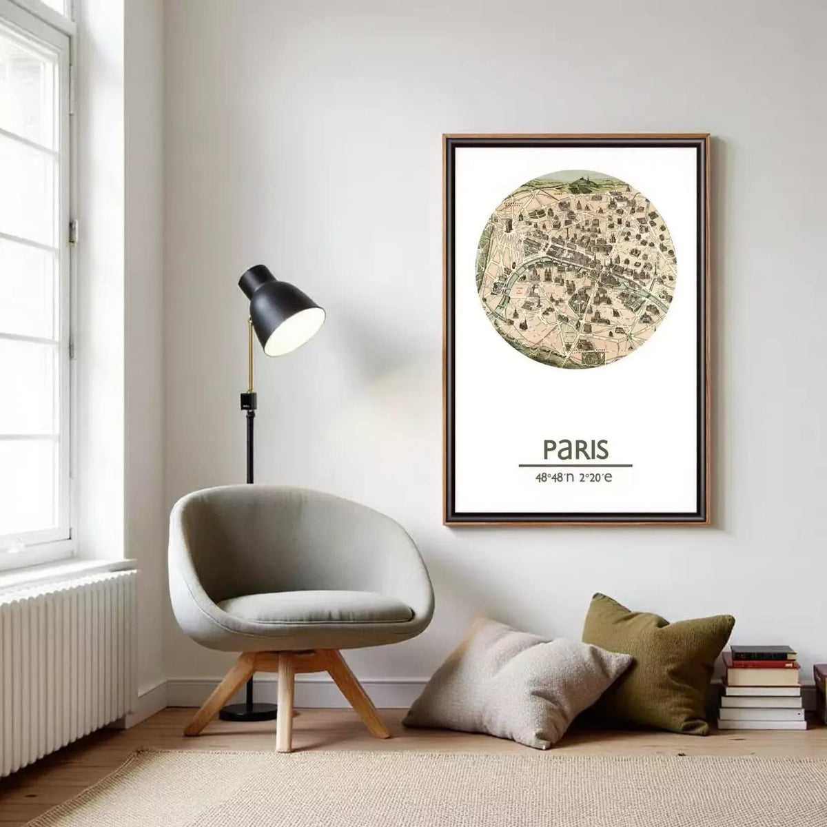 a living room with a gray armchair, a floor lamp, and a framed map of Paris hanging on the wall.