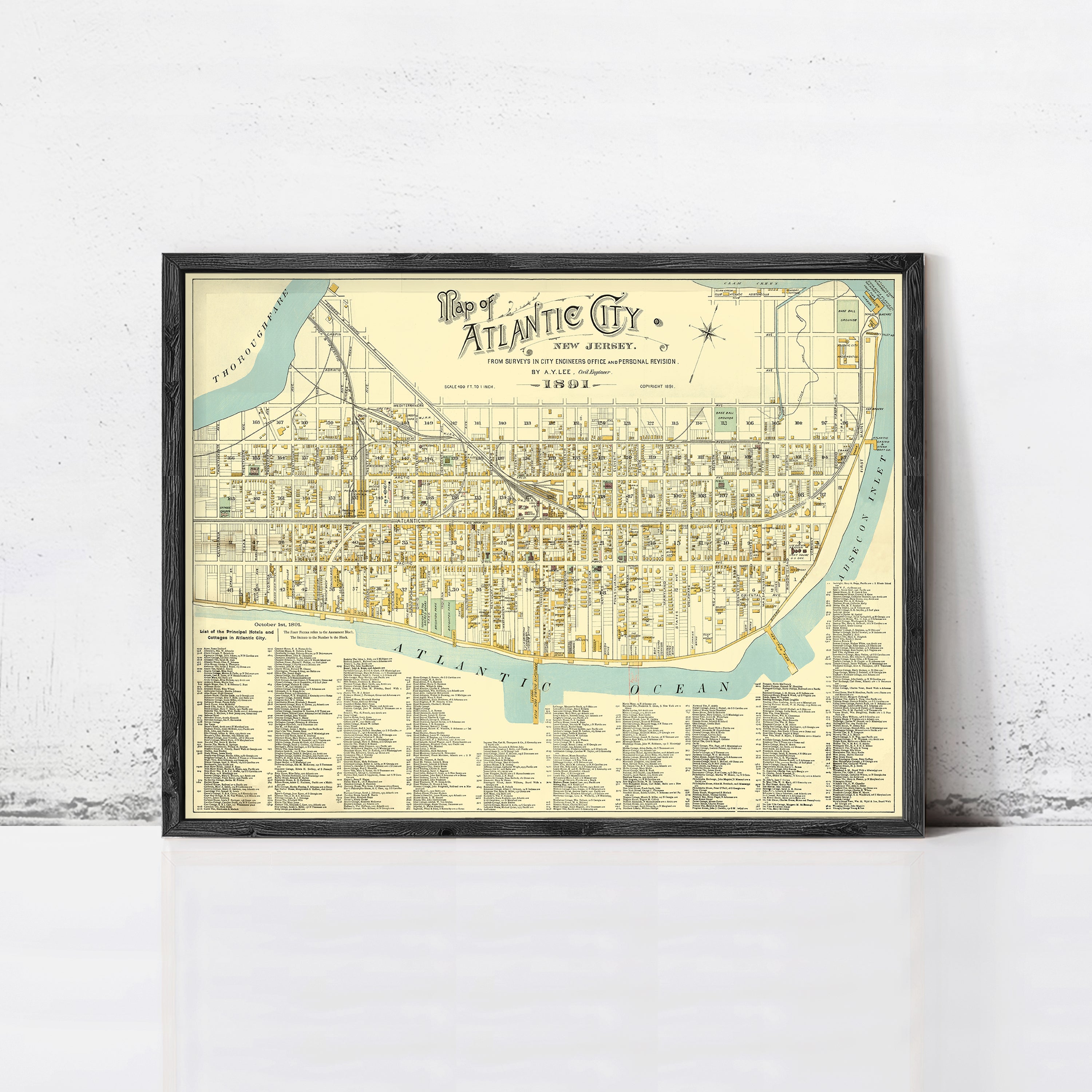 The image is a framed vintage map of the Atlantic City, New Jersey, depicting the city's streets, landmarks, and surrounding areas.