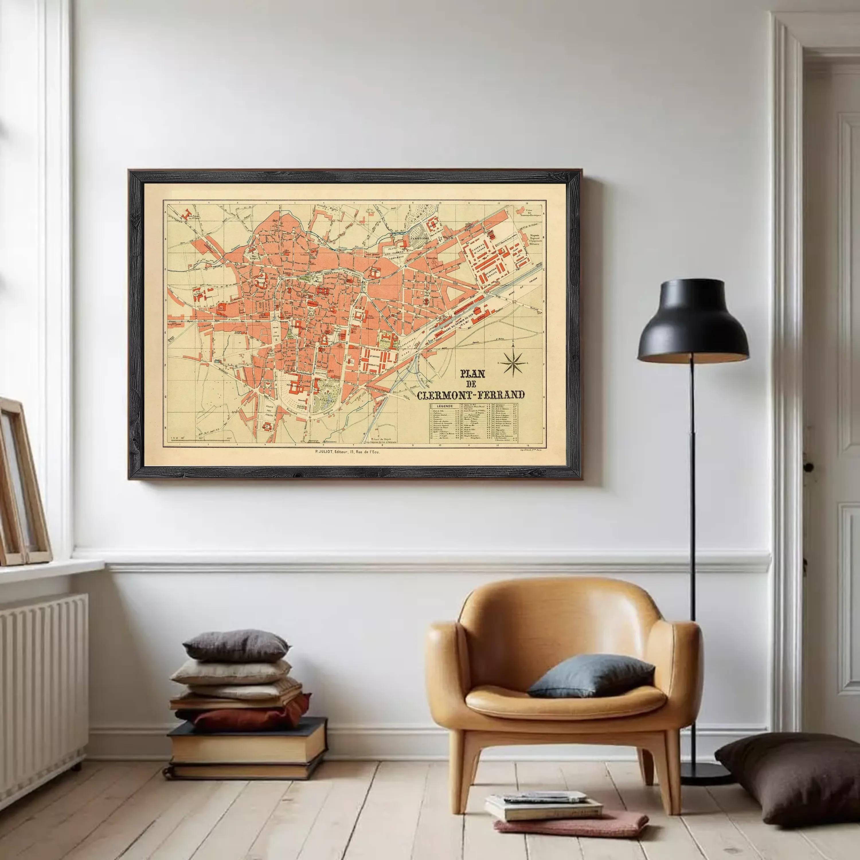The image is a framed vintage map of the city of Clermont-Ferrand, France, depicting the layout and geographical features of the area.