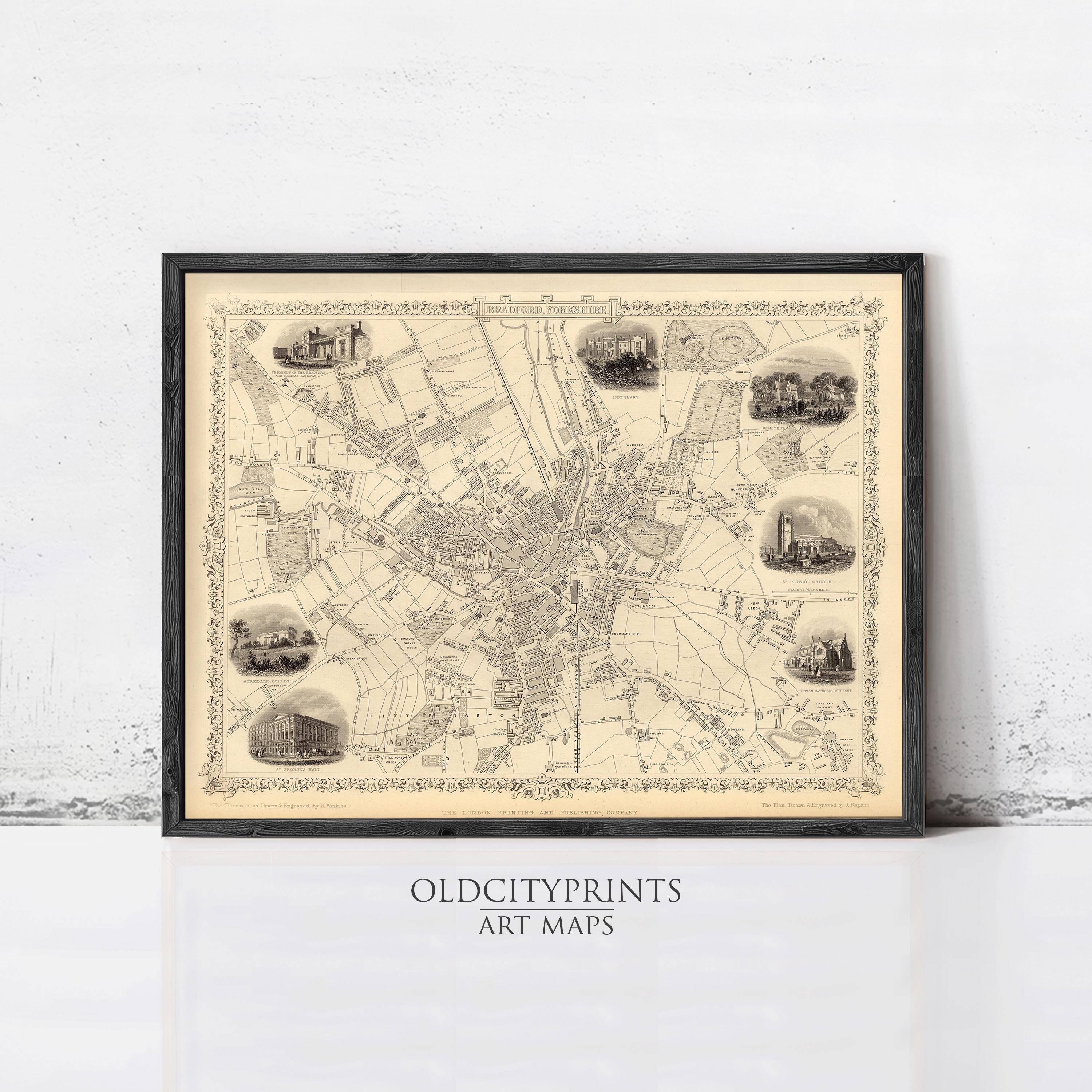 The image is a framed vintage map of a city, featuring various landmarks and streets.