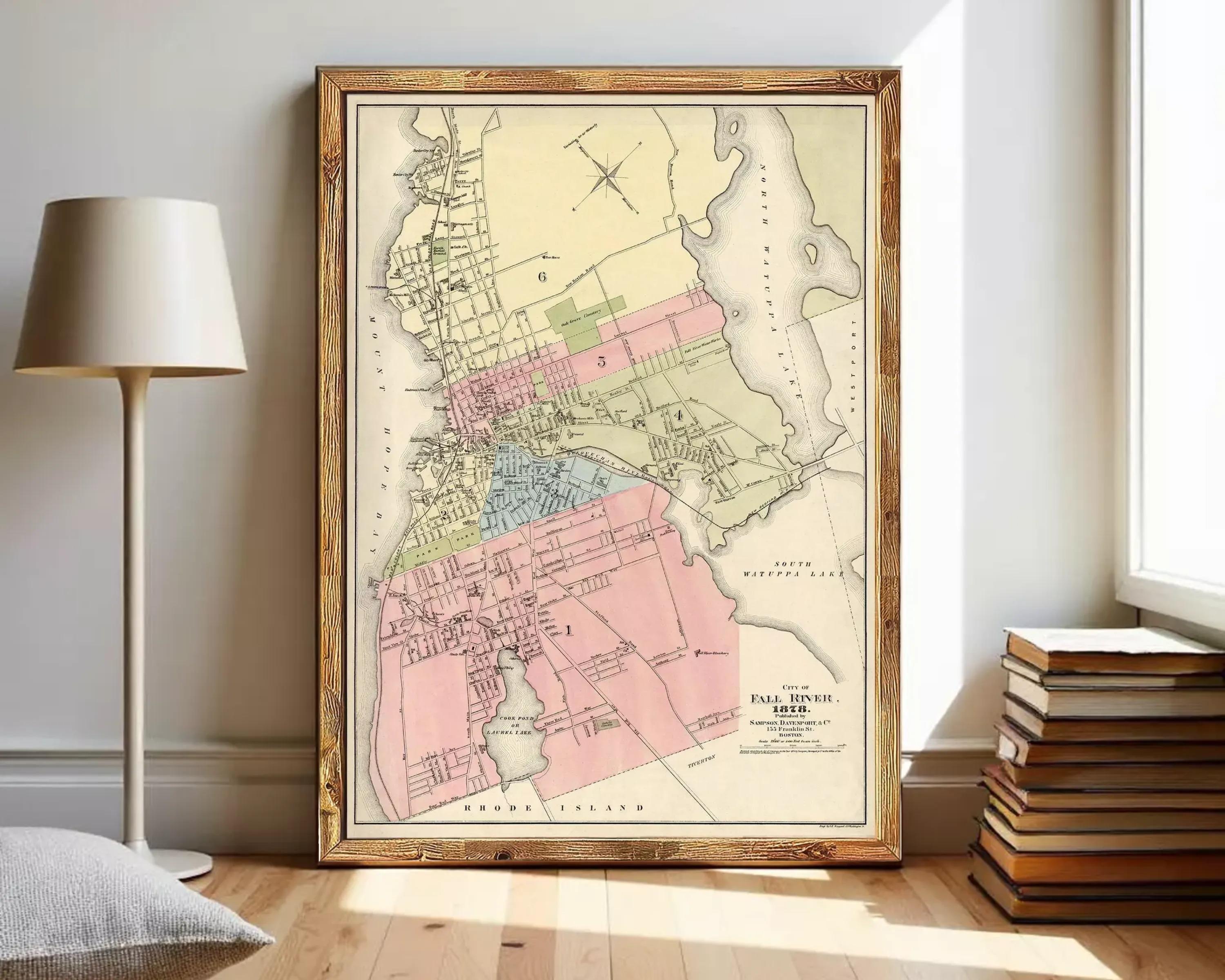 The image is a framed vintage map of a city, likely from the late 19th century, depicting the layout and boundaries of the city.
