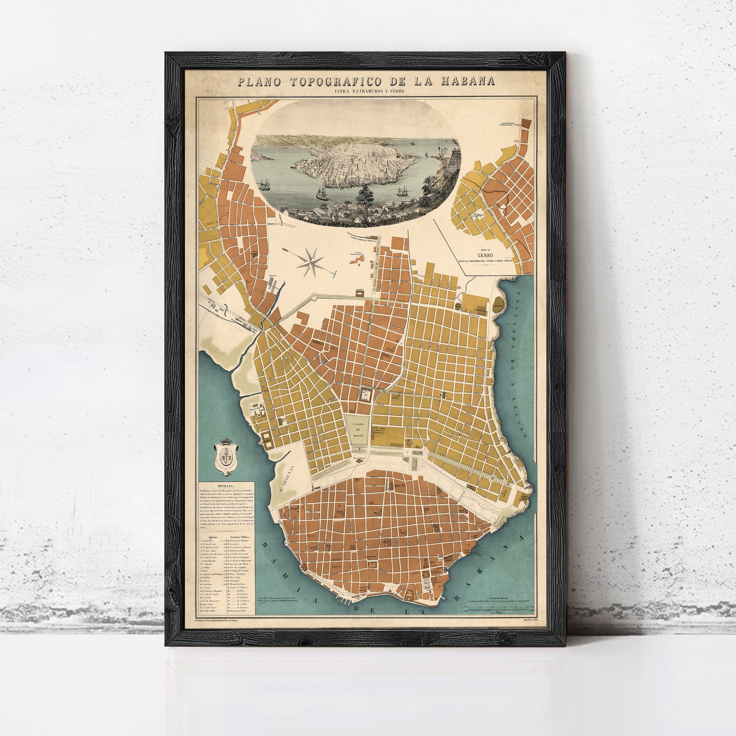 The image is a framed vintage map of a city, likely Havana, Cuba, with a detailed illustration of the city's layout and surrounding areas.