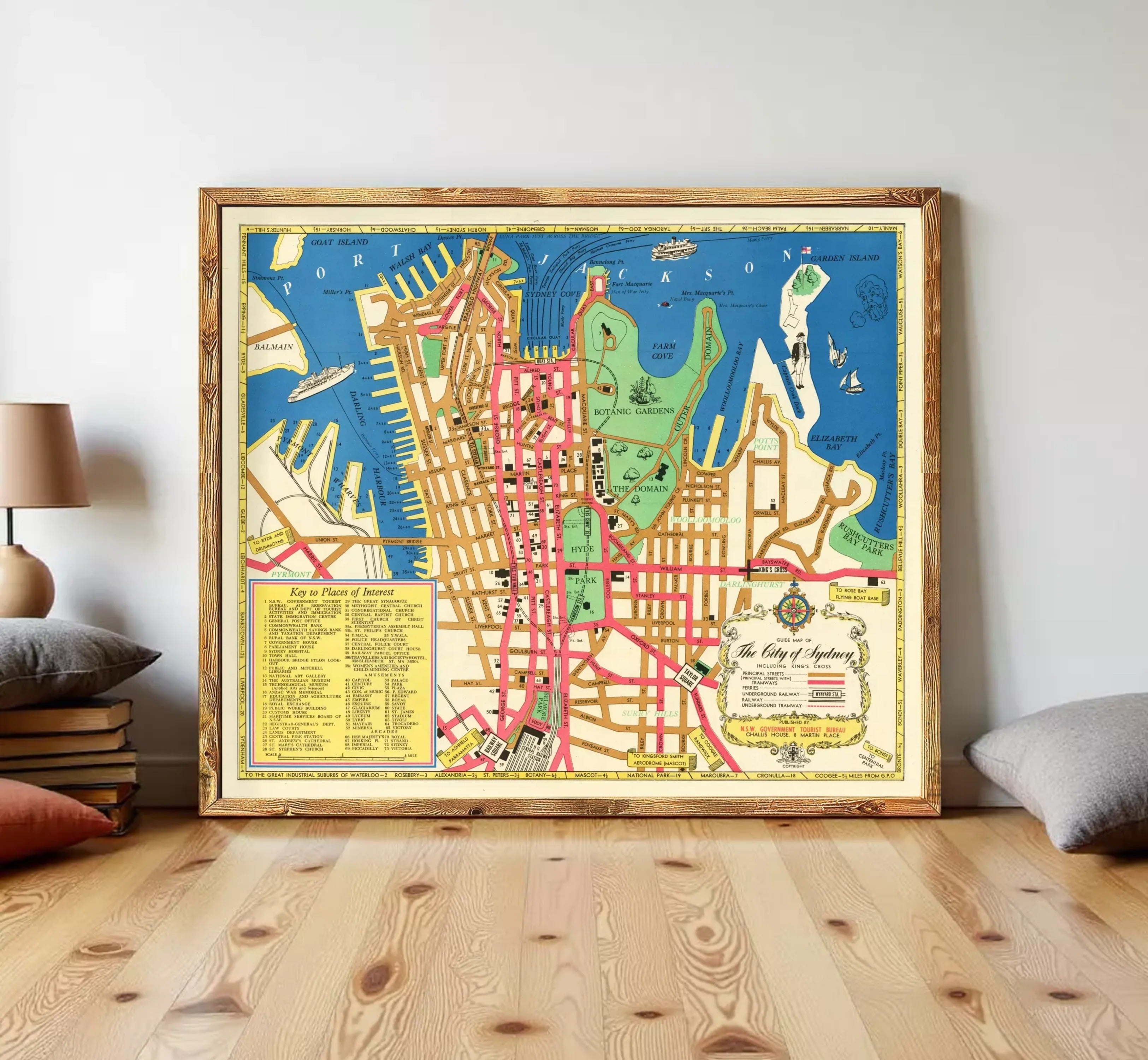 The image is a framed vintage map of a city, likely Sydney, Australia, with various landmarks and streets labeled.