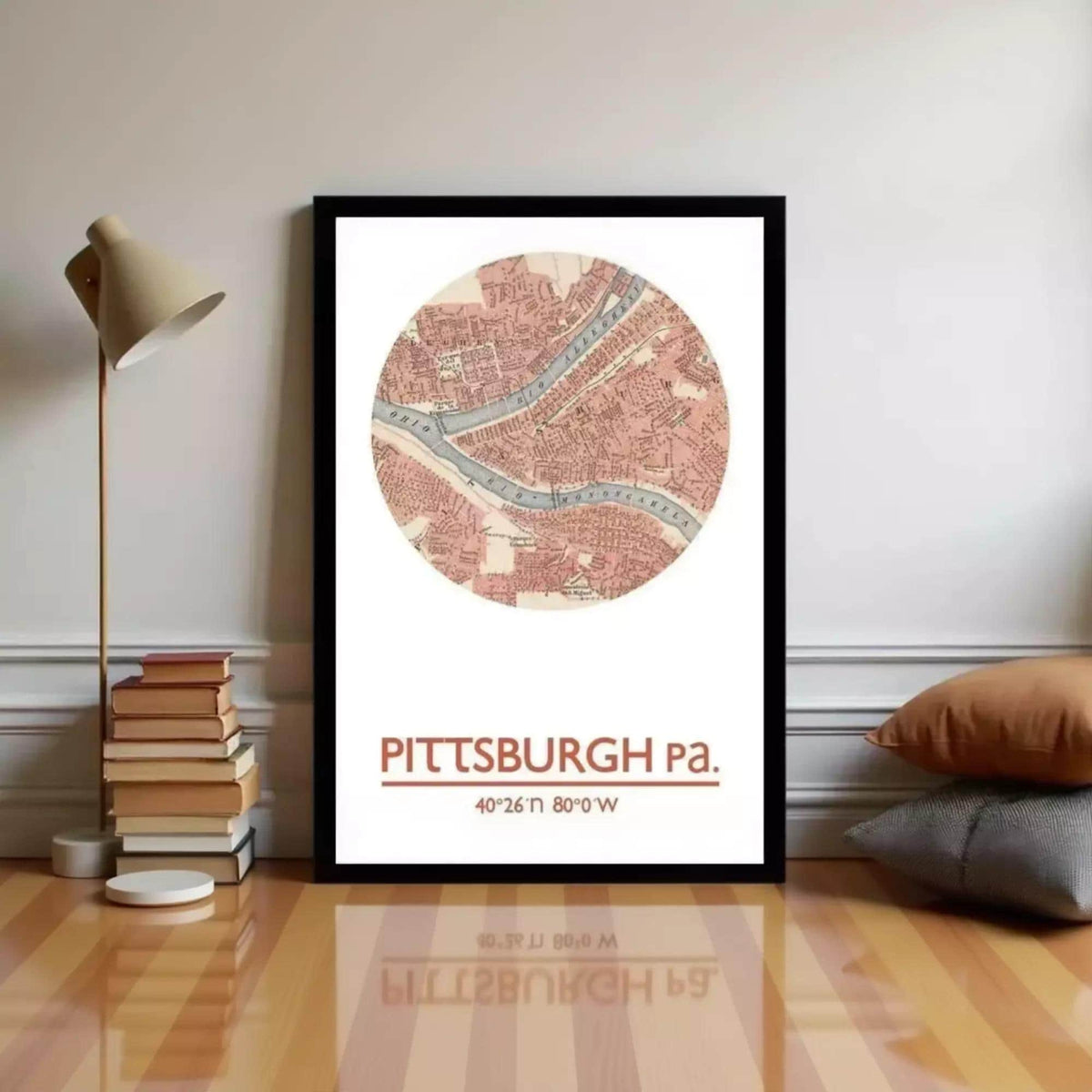 A framed map of Pittsburgh, Pennsylvania, with the text "PITTSBURGH Pa. 40.26° N 80° W" printed on it.
