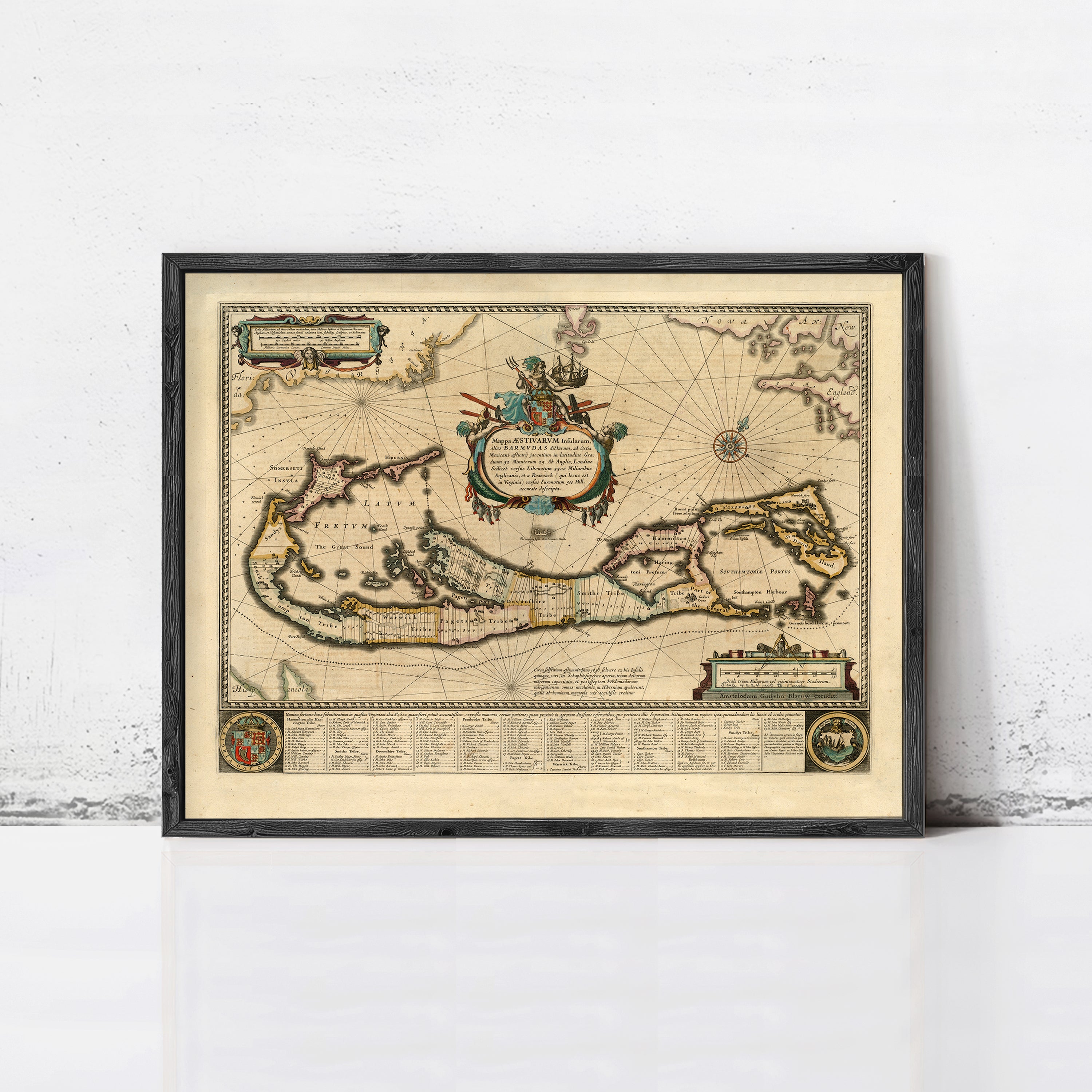 The image is a framed antique map of the Caribbean, featuring intricate details and a decorative border.