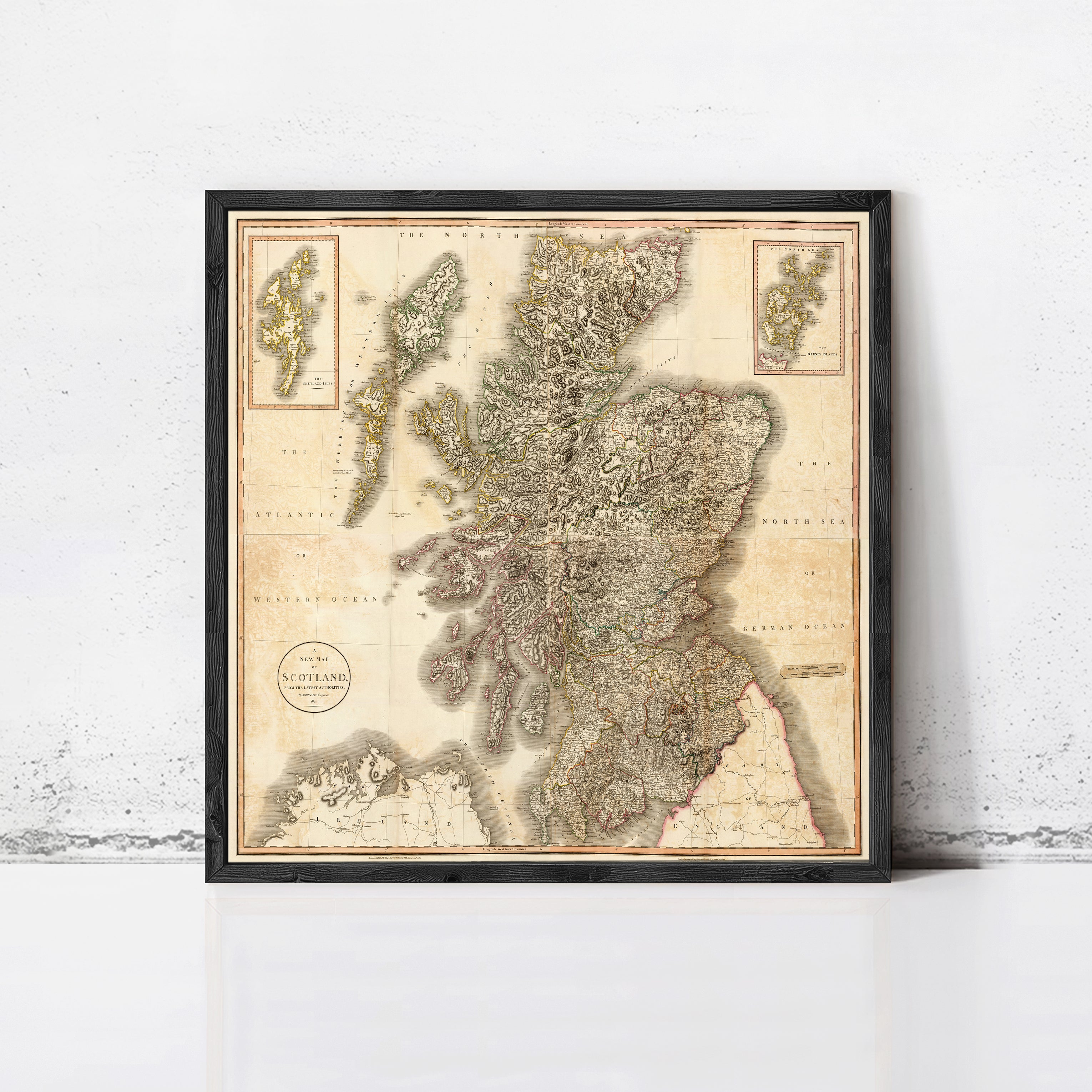 The image is a framed map of Scotland, showing the country's geographical layout and surrounding areas.