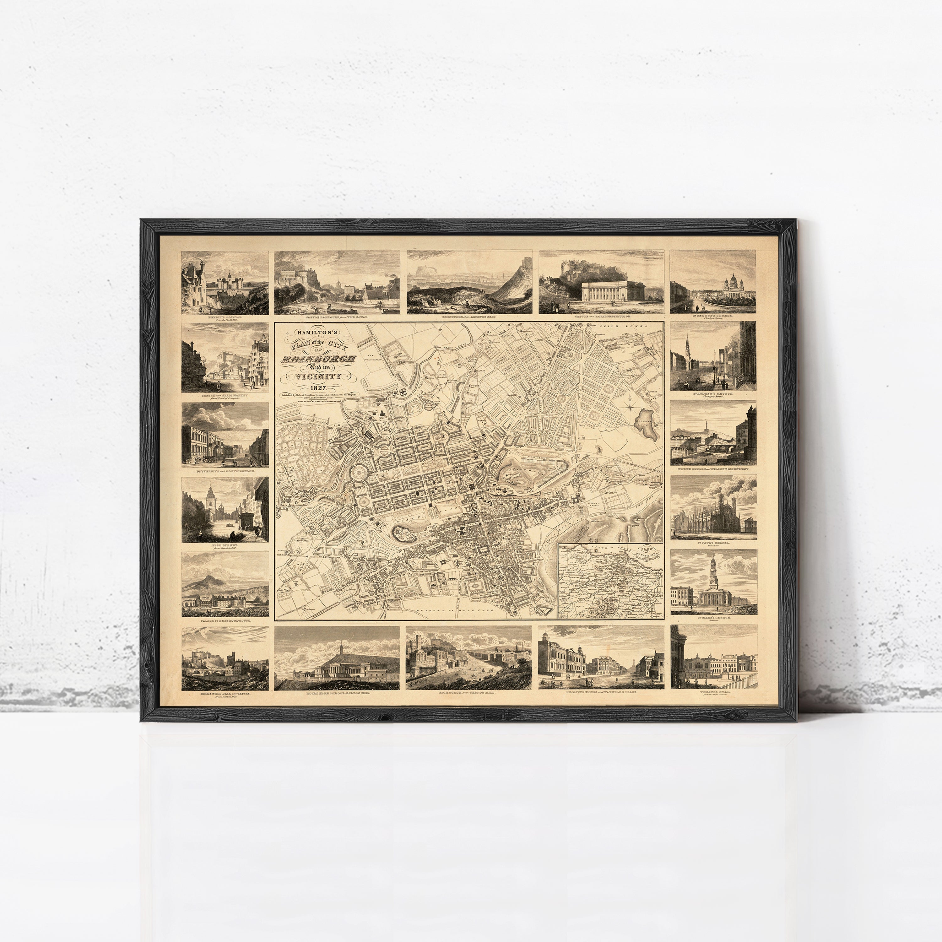 The image is a framed vintage map of a city, featuring a detailed layout of streets, buildings, and landmarks.