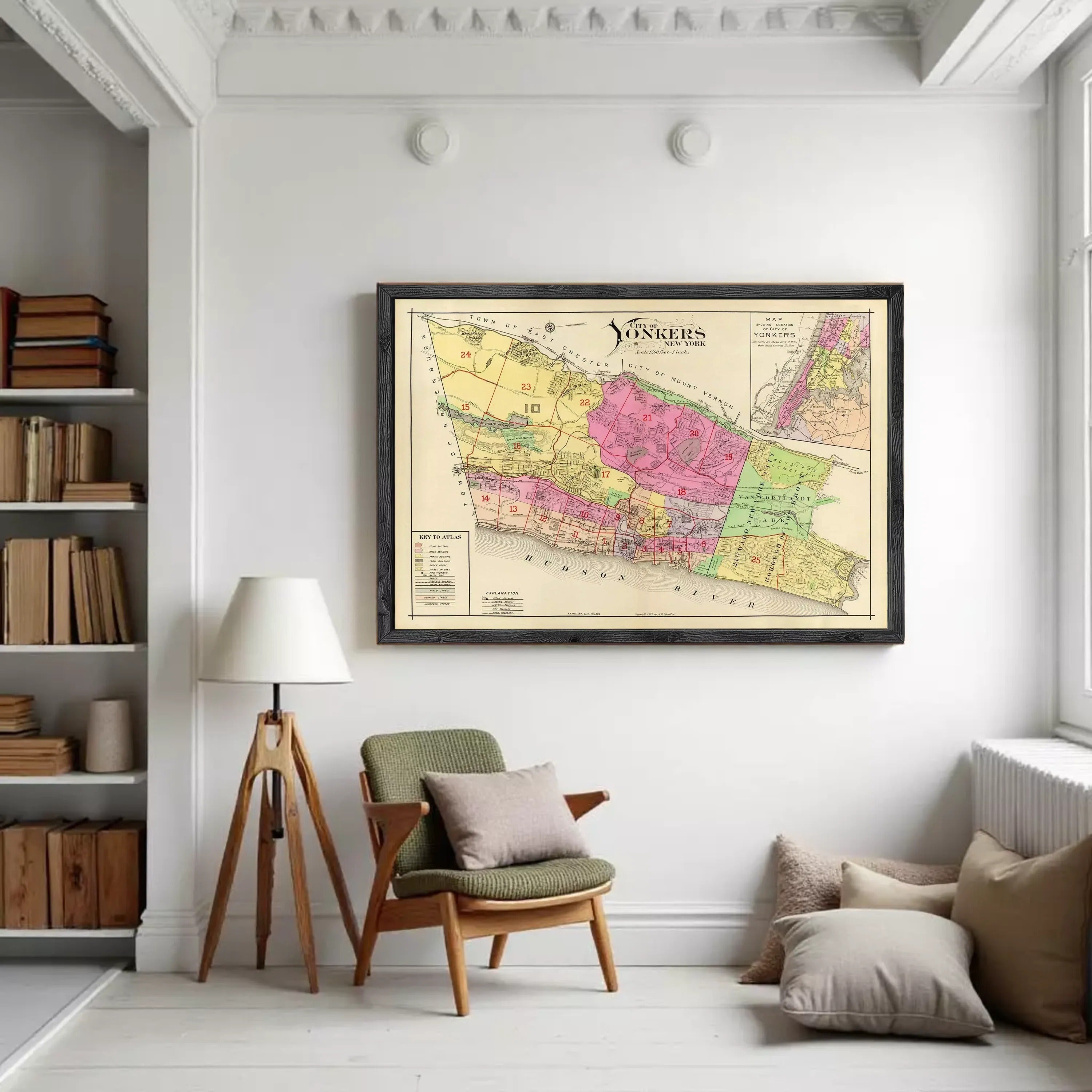 a large framed map of the Yonkers region hanging on a white wall in a cozy living room setting.