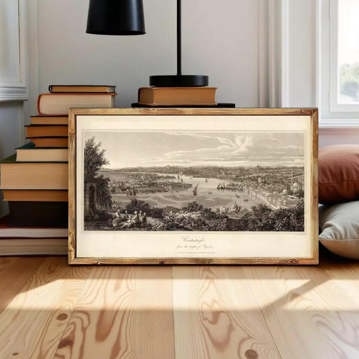 The image is a framed print depicting a landscape with a river, buildings, and trees.