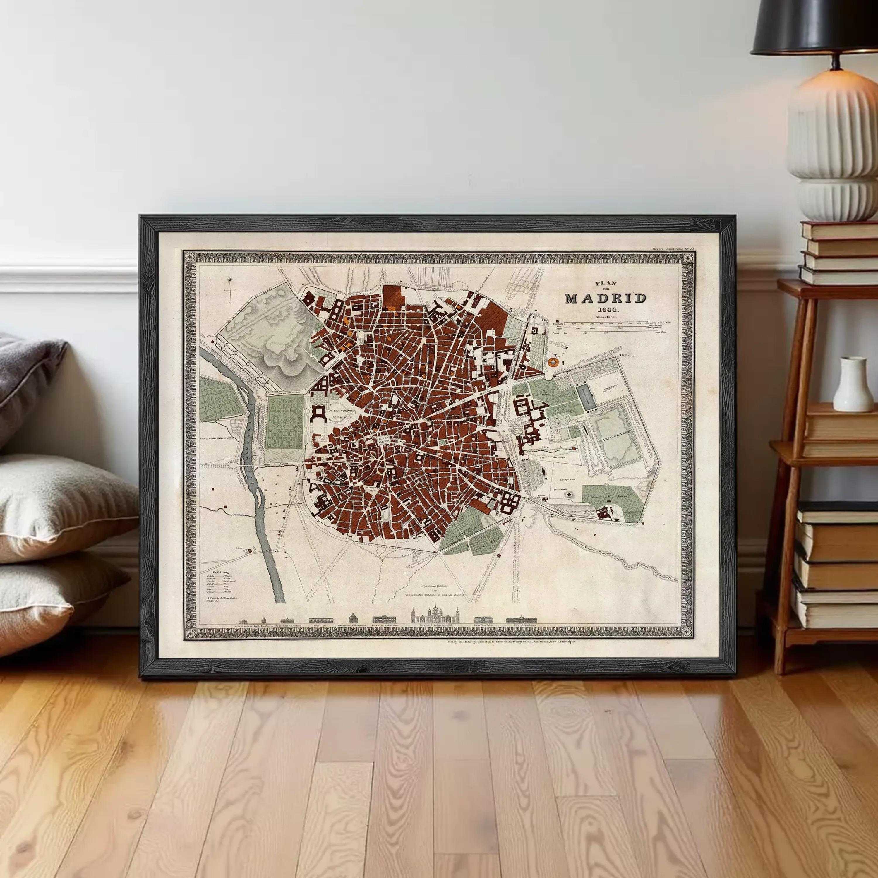 The image is a framed map of Madrid, Spain, depicting the city's layout and surrounding areas.
