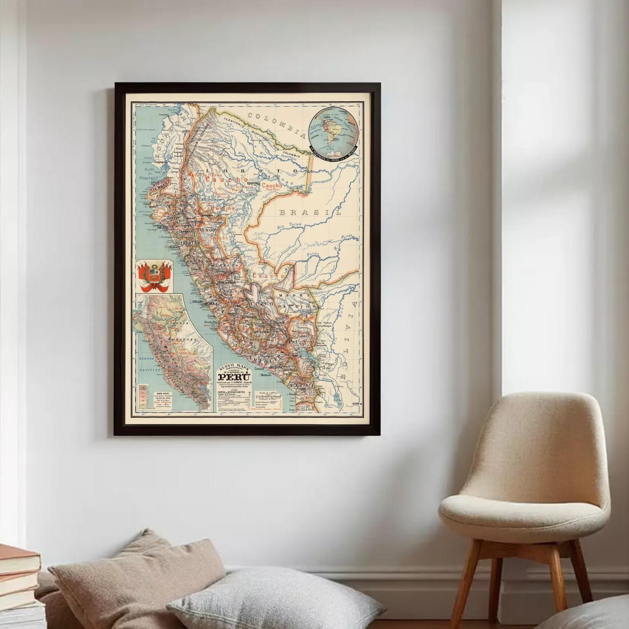 a framed vintage map of South America hanging on a wall, with a beige chair and a stack of books visible in the foreground.
