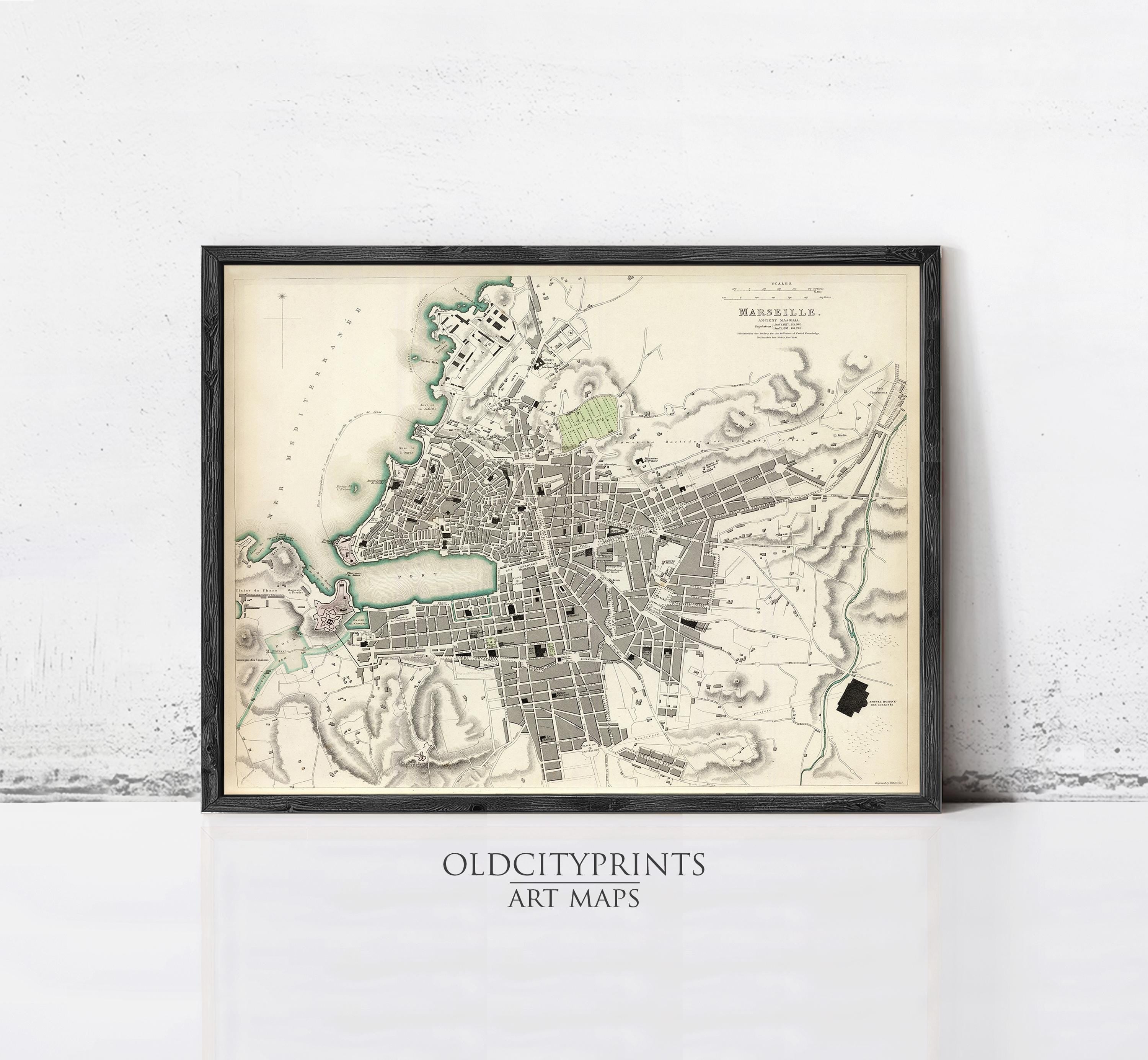 The image is a framed vintage map of a city, likely from the 19th century, with detailed cartography and markings.