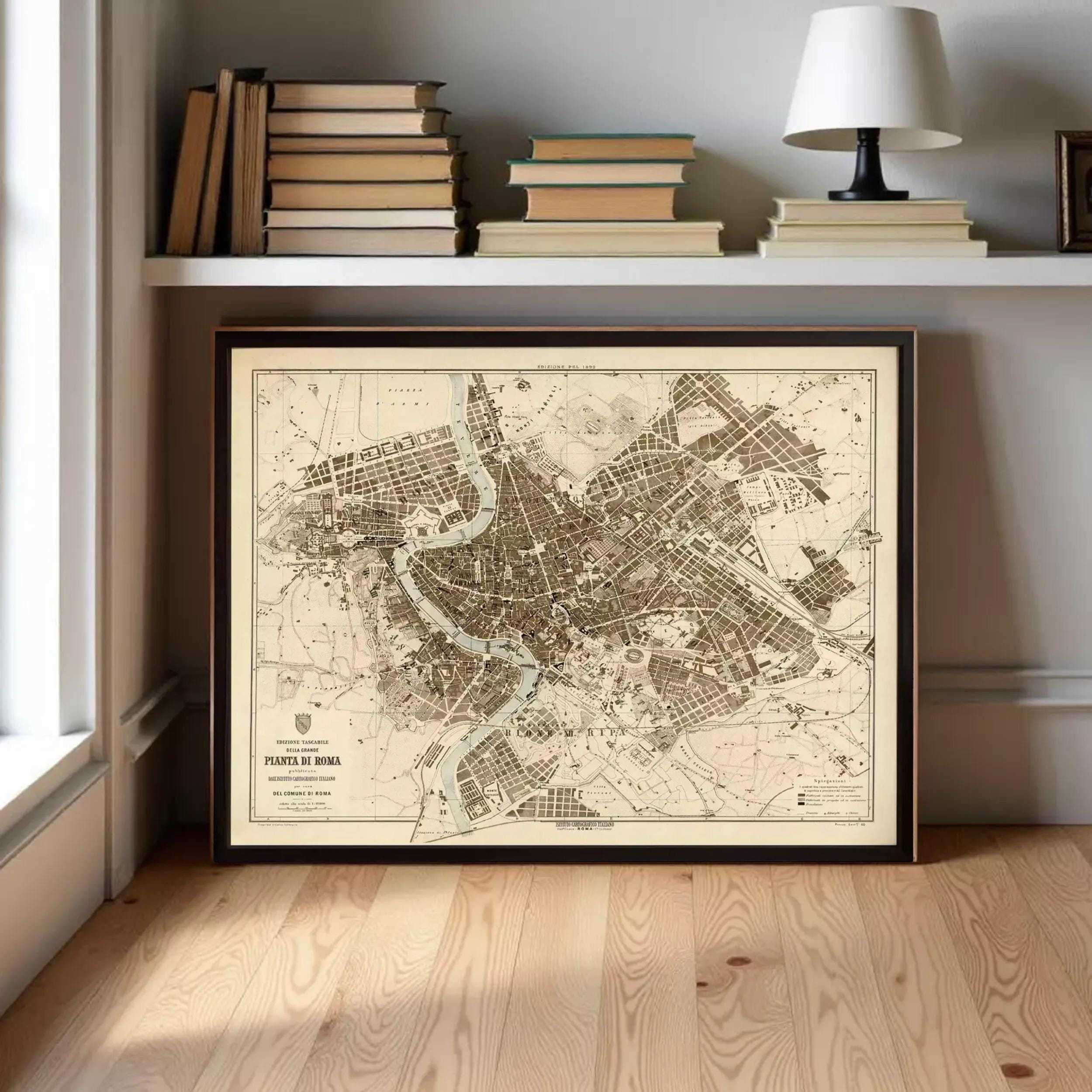 a framed map of Rome, Italy, displayed on a shelf above a bookshelf.