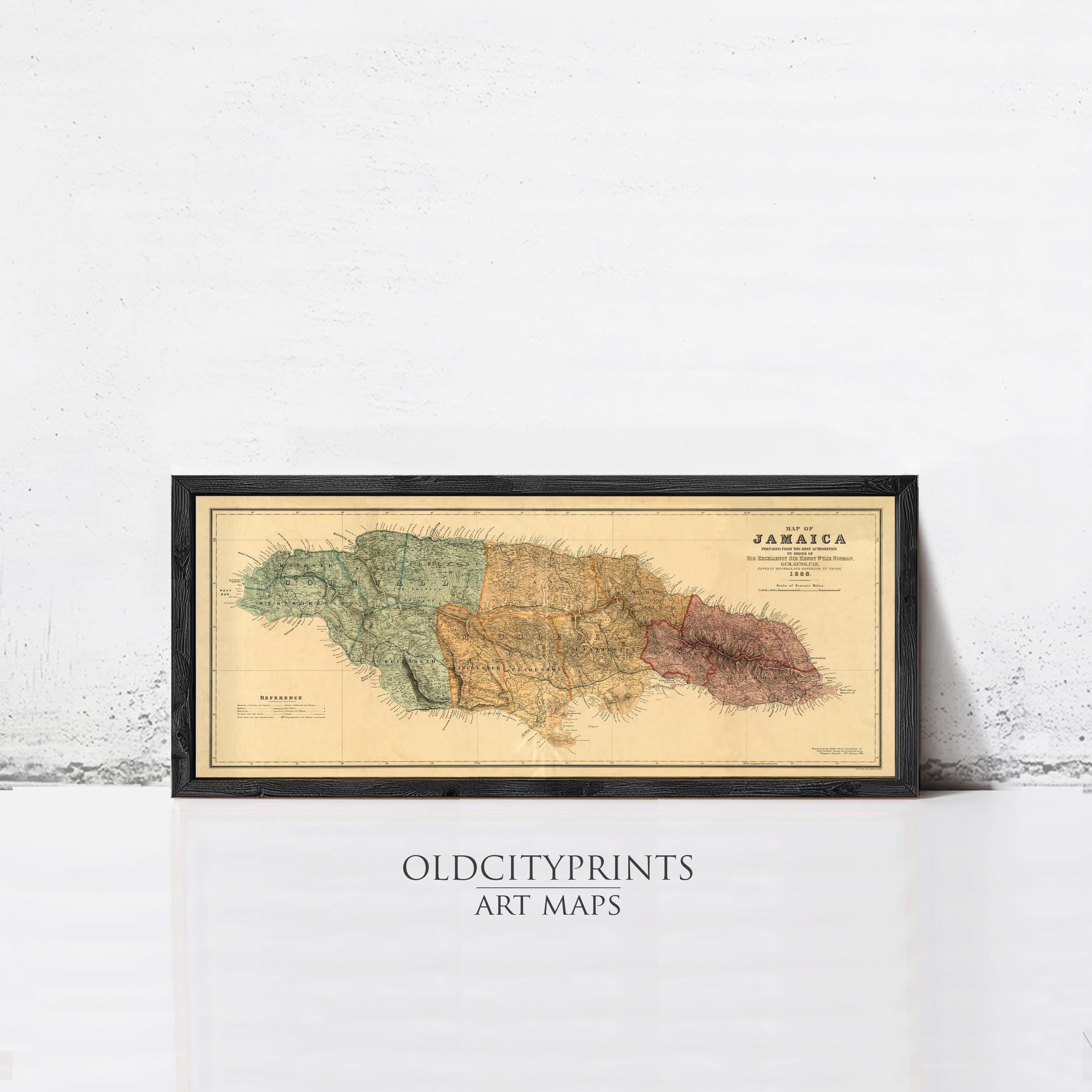 The image is a framed vintage map of Jamaica, depicting the country in a detailed and colorful manner.