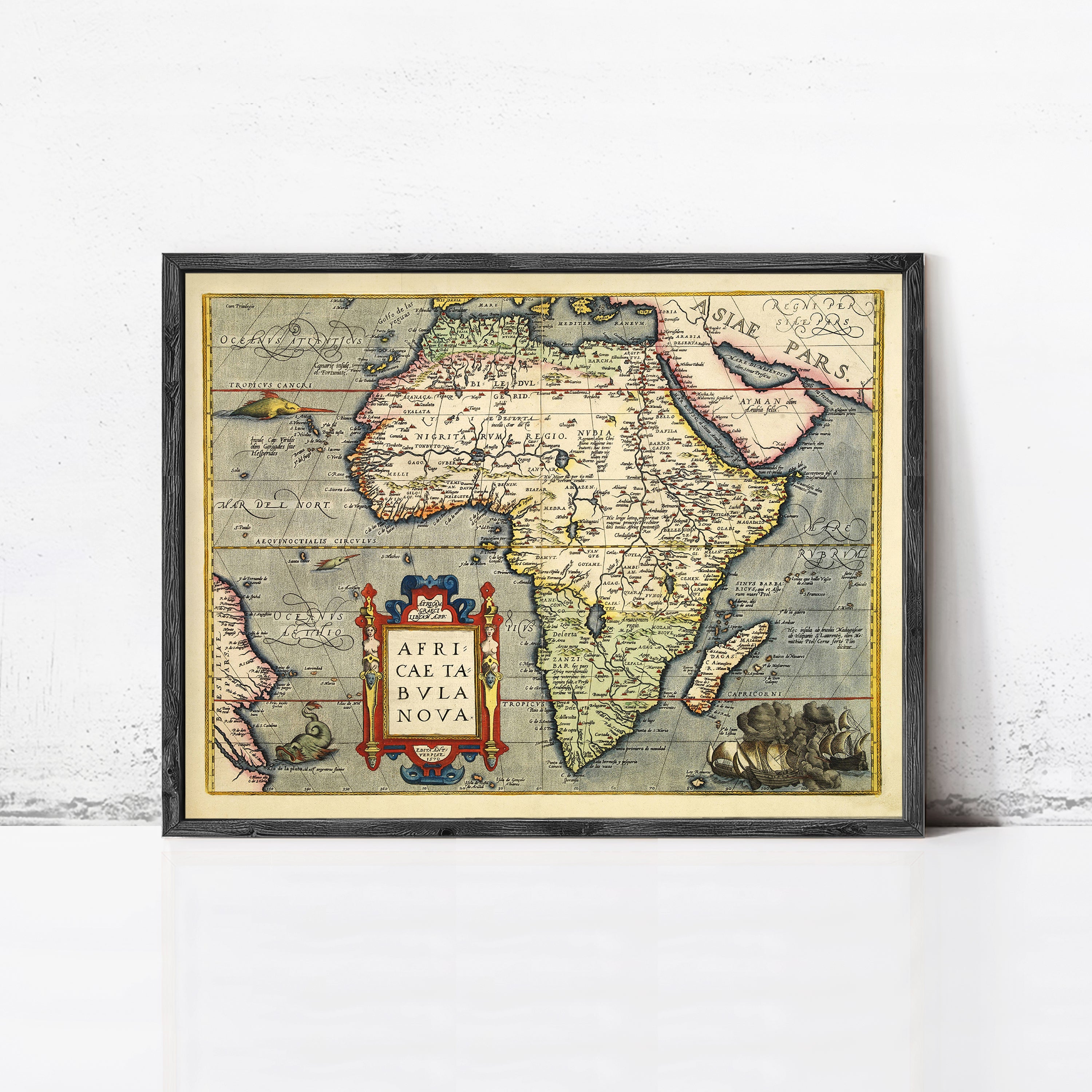 The image is a framed vintage map of Africa, depicting the continent and surrounding bodies of water.