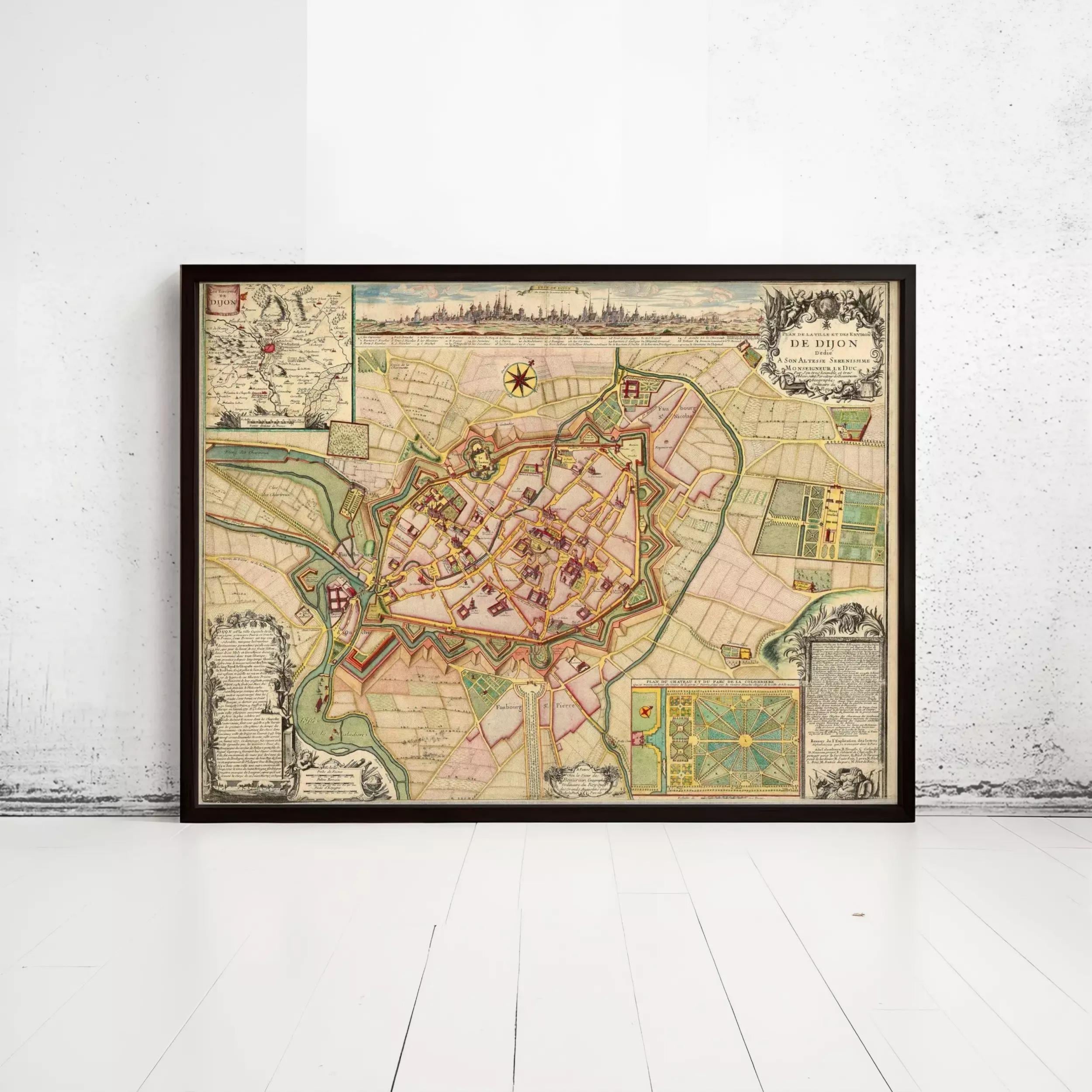 The image is a framed vintage map of a city, likely from the 16th century, displayed on a white wall.