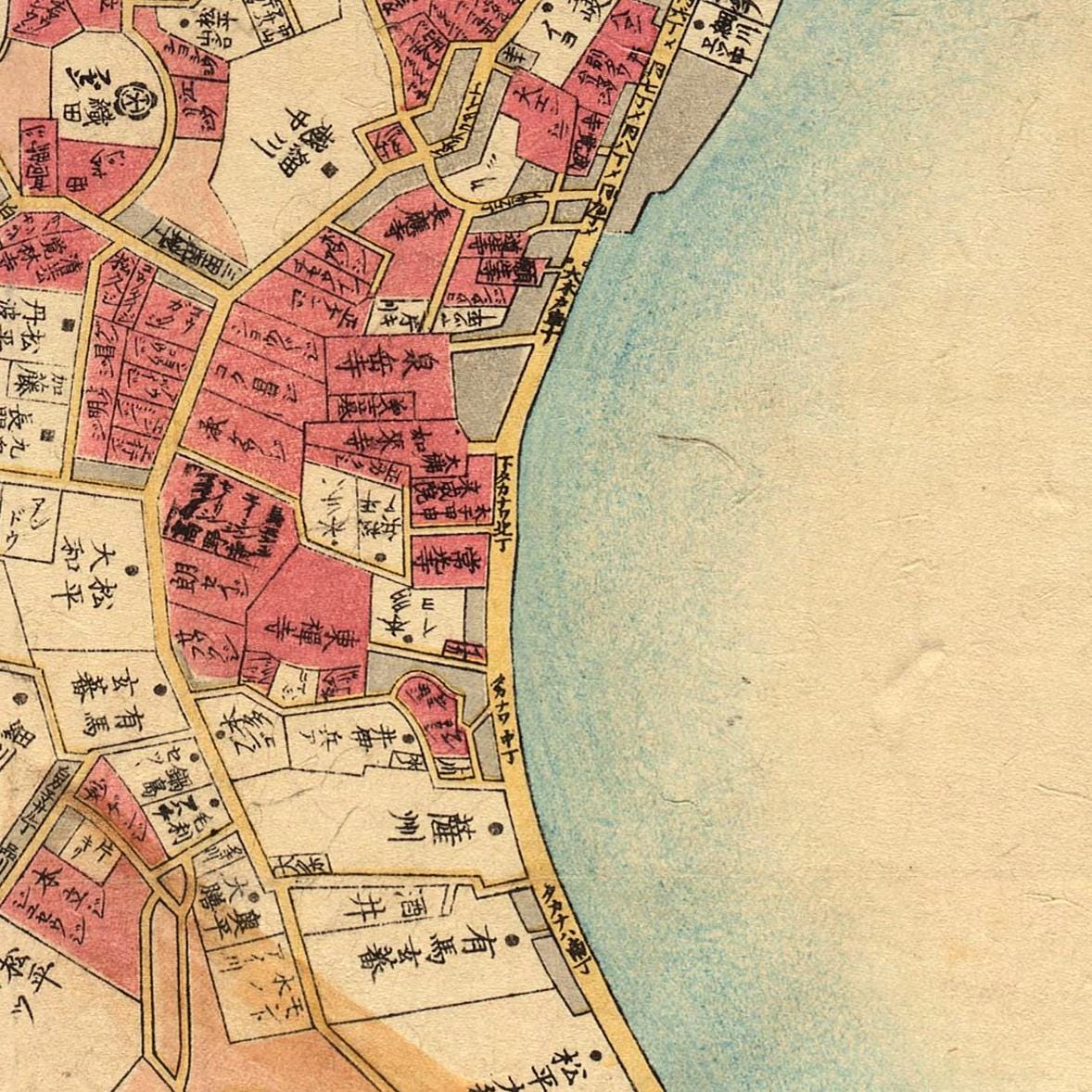 The image is a detailed map of a city, showing various buildings, roads, and other urban features. The map is in Japanese and appears to be a historical or vintage representation of the city.