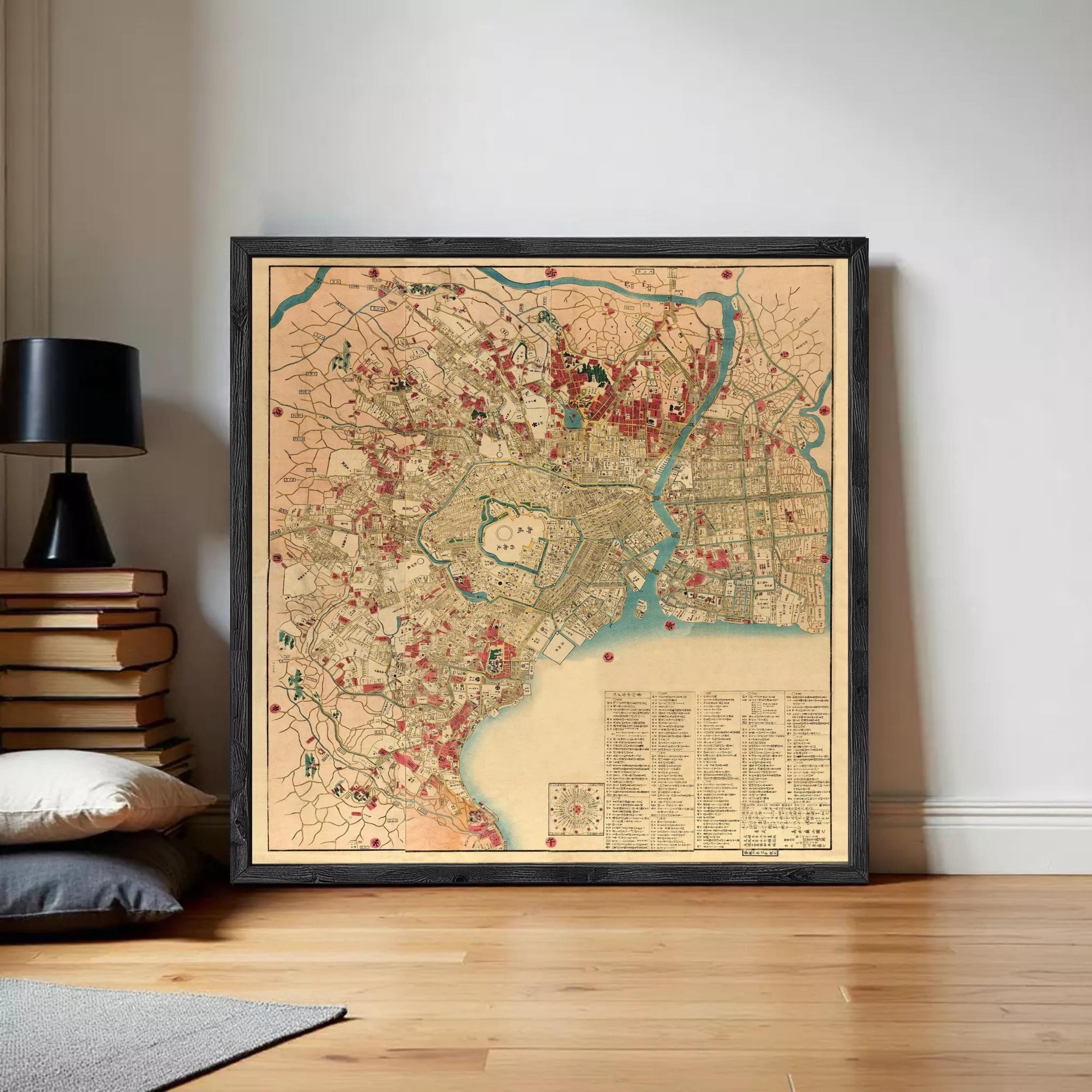 The image is a framed vintage map of a city, likely from the 19th century, with various landmarks and streets depicted in a detailed and colorful manner.