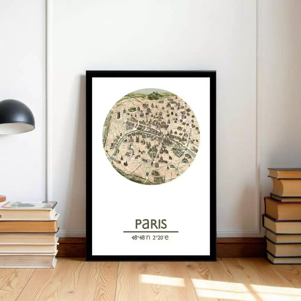 A framed map of Paris, with the city's streets and landmarks depicted in a circular format.