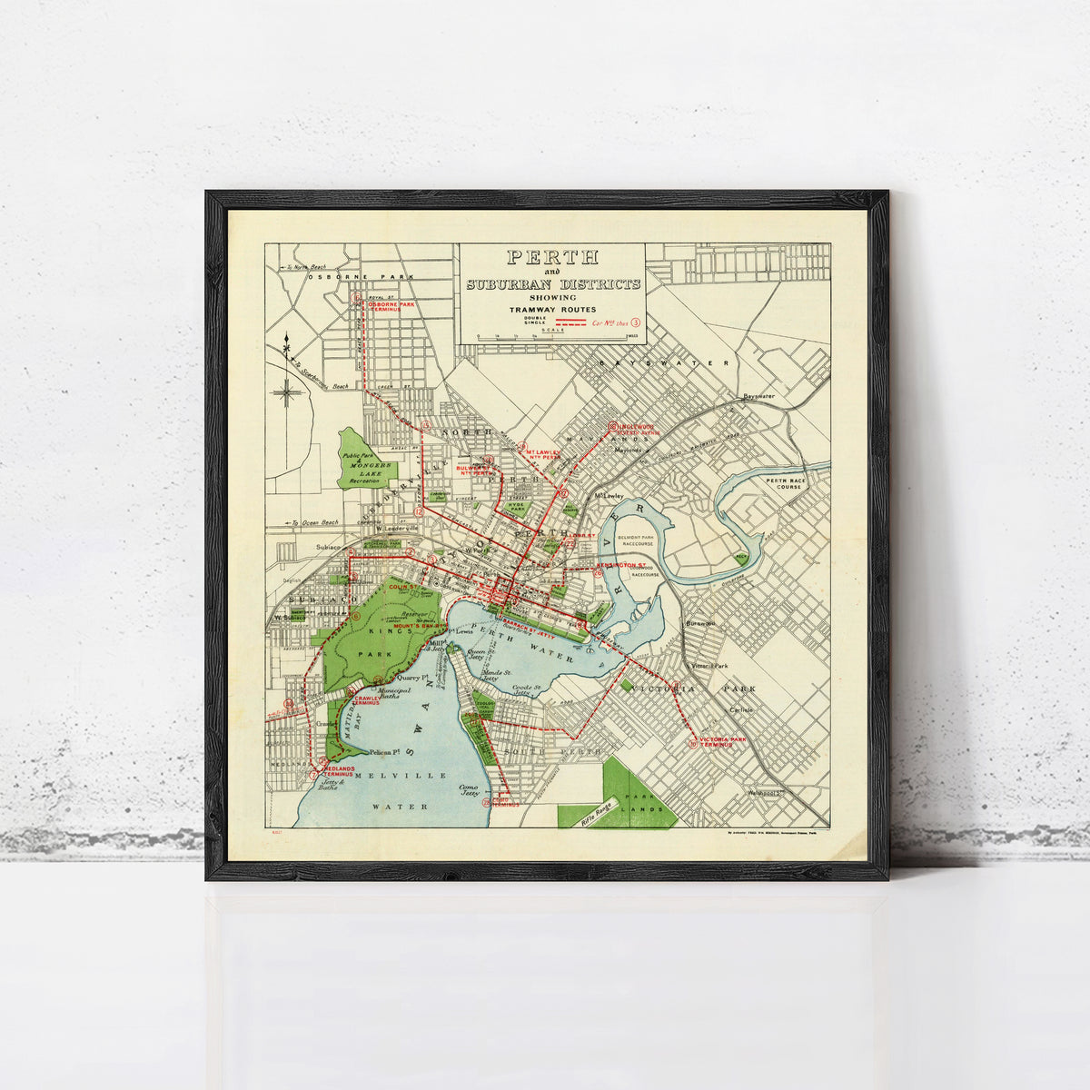 The image is a framed vintage map of the city of Perth, Australia, depicting the city's streets, parks, and other landmarks.
