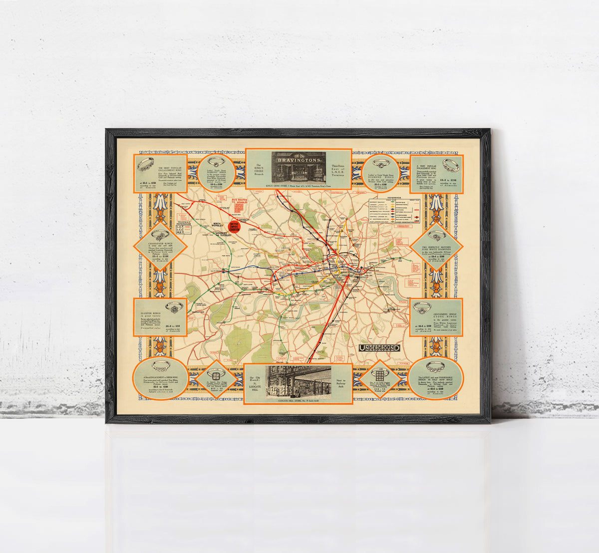 The image is a framed vintage map of London, featuring various landmarks and transportation routes.