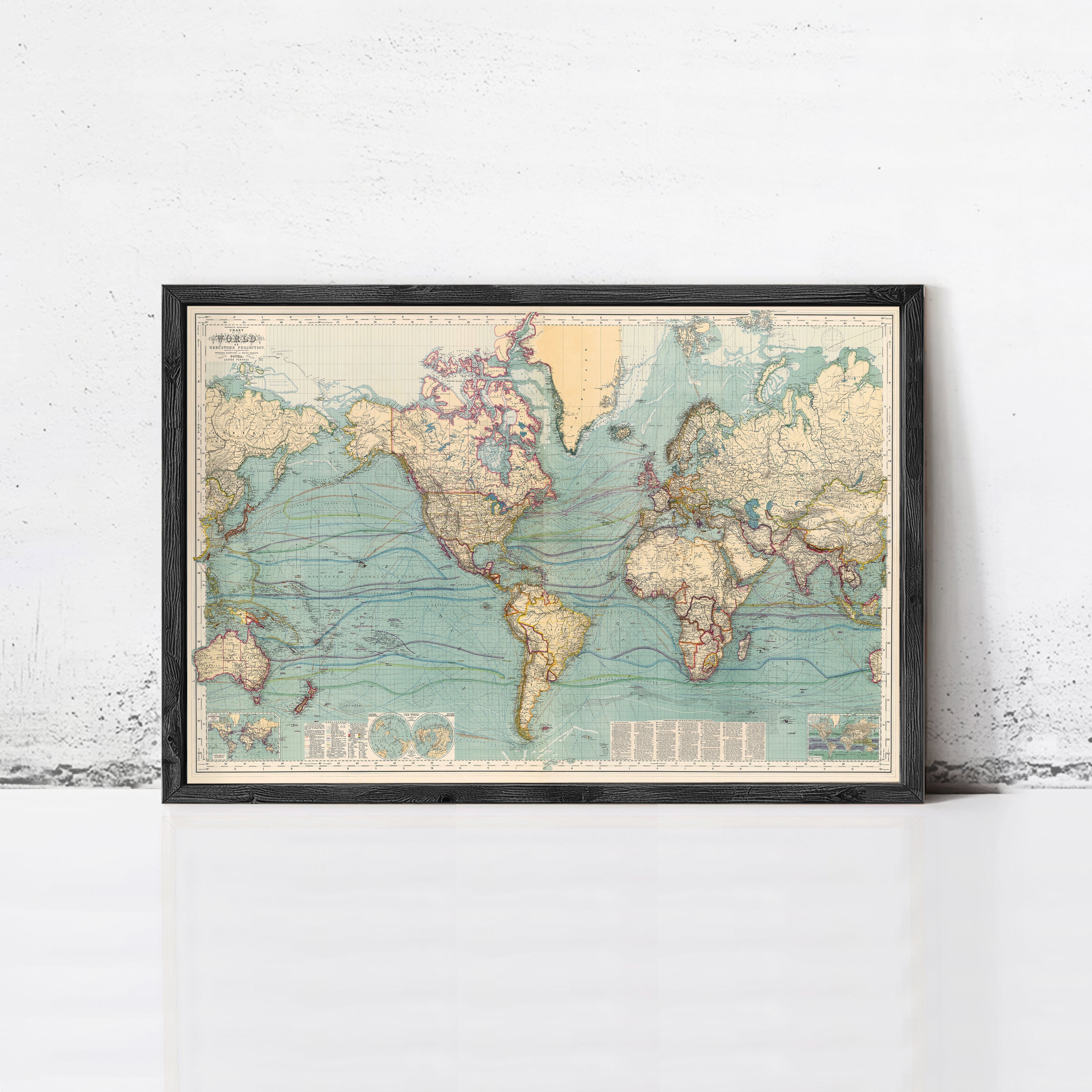 The image is a framed vintage map of the world, depicting the continents and oceans in a detailed and colorful manner.