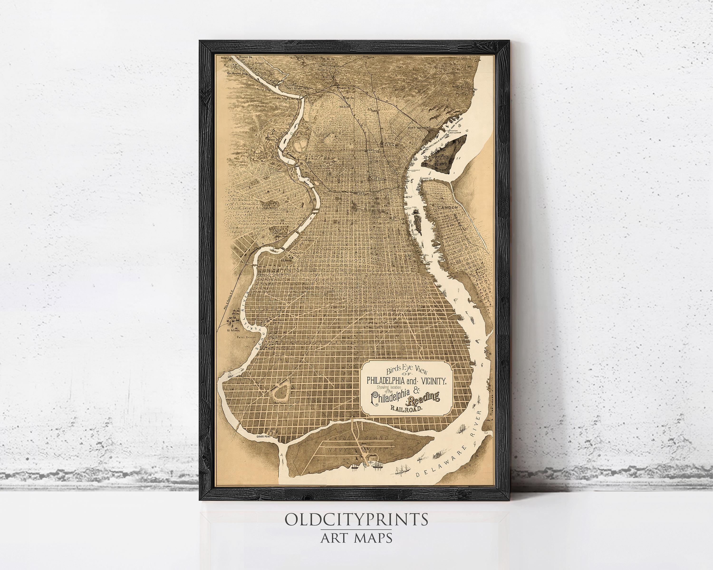 The image is a framed antique map of Philadelphia, Pennsylvania, depicting the city's streets and surrounding areas.