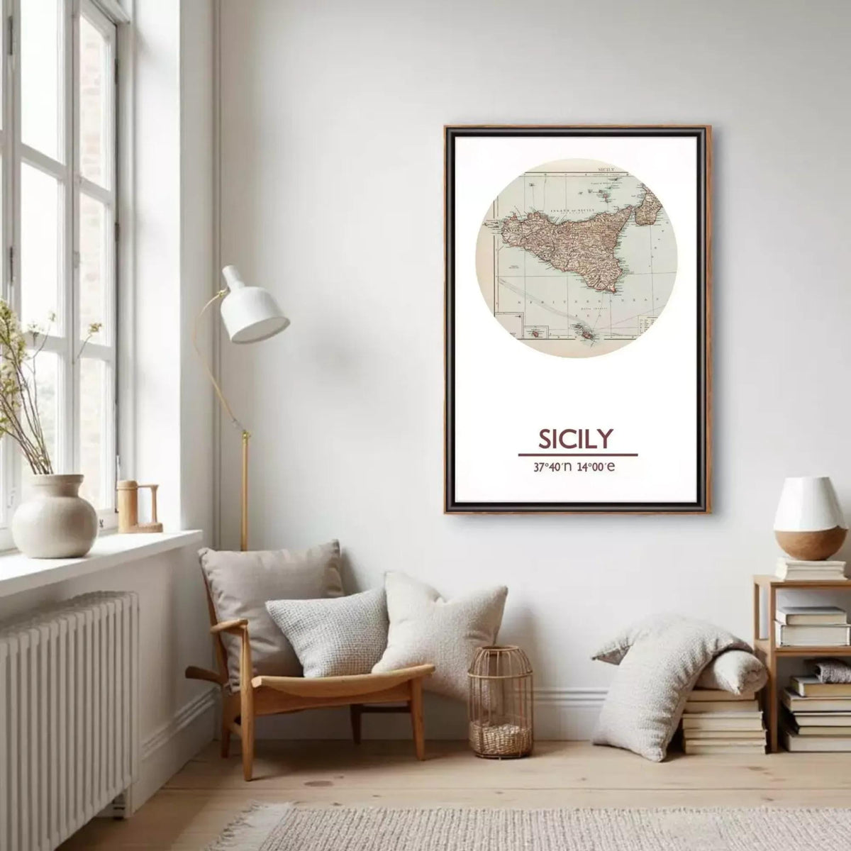 a cozy living room with a large framed map of Sicily hanging on the wall. The room has a comfortable seating area with a chair and a small table, as well as a bookshelf filled with books. The overall decor has a warm and inviting atmosphere.