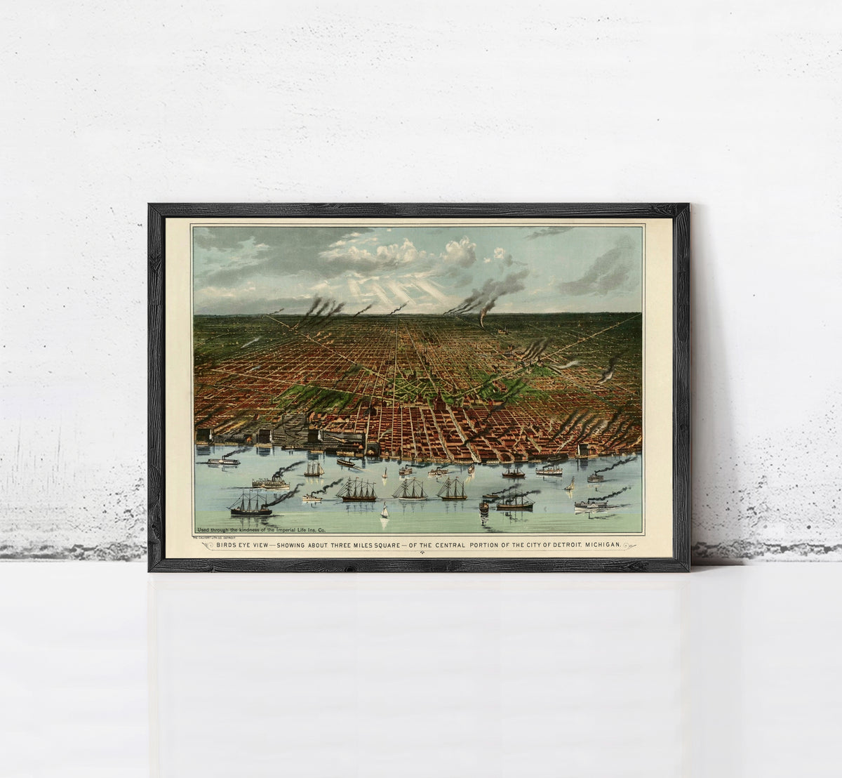 The image is a framed painting depicting a cityscape with boats in the water, set against a cloudy sky.