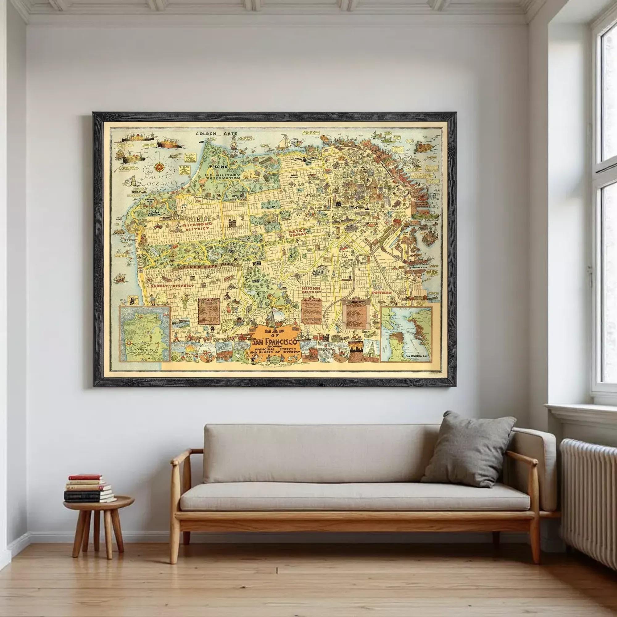 a large framed map hanging on a wall above a couch in a living room.