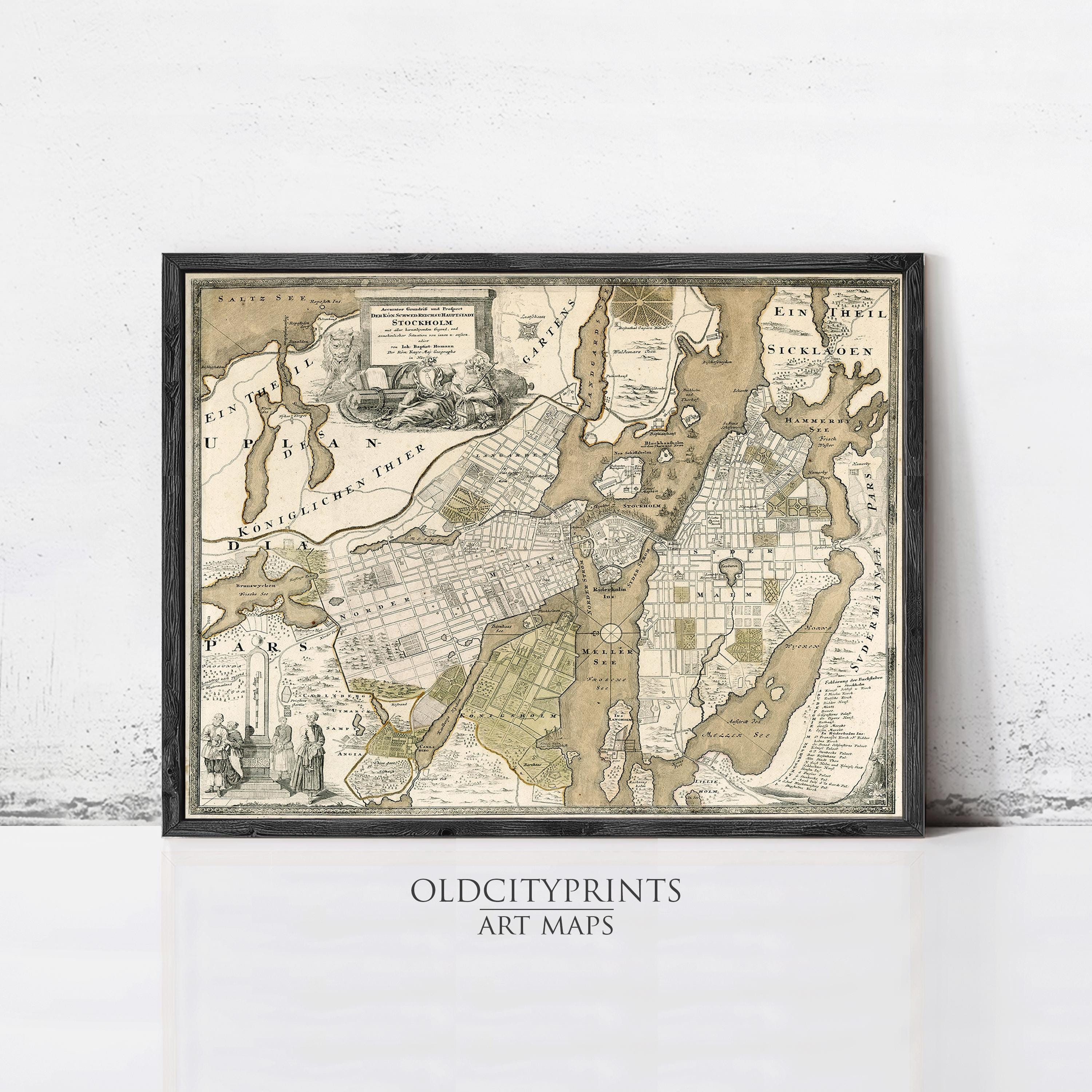 The image is a framed antique map of a city, likely from the 17th century, with detailed cartography and illustrations.