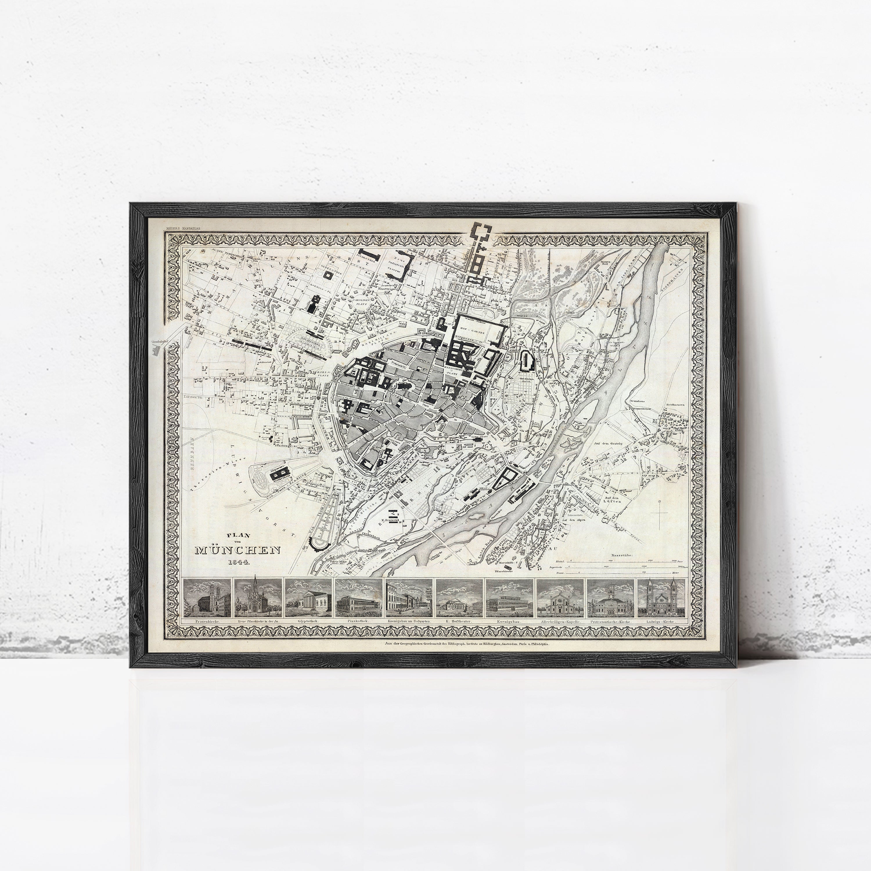 The image is a framed map of a city, likely from the 19th century, with a detailed layout and various landmarks.