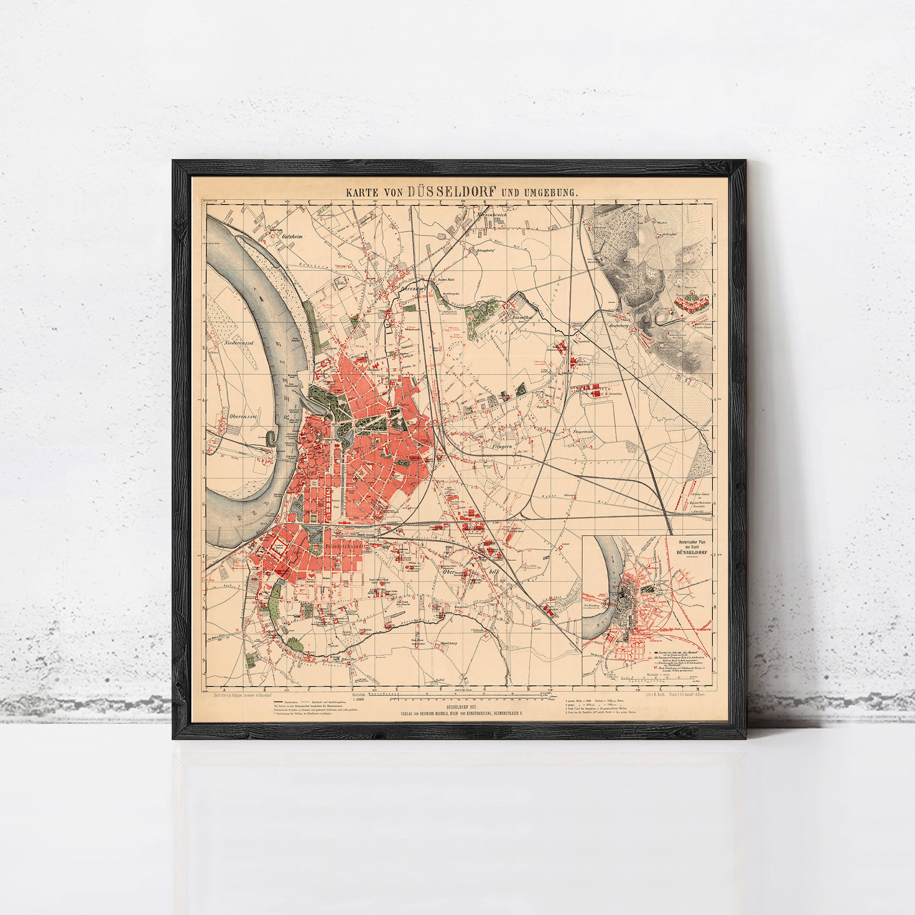 The image is a framed vintage map of Dusseldorf, Germany, depicting the city's layout and surrounding areas.