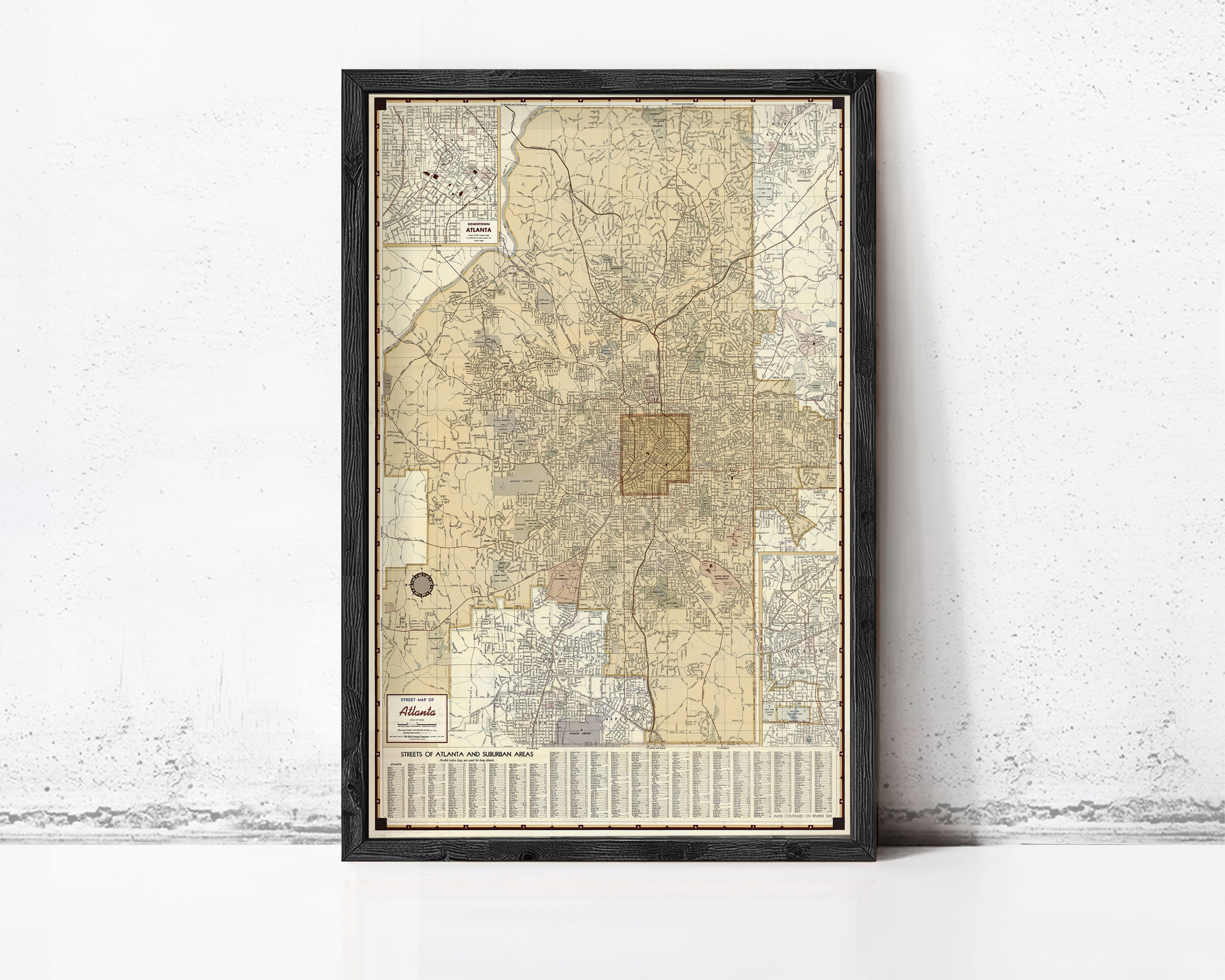 The image is a framed vintage map of Atlanta, Georgia, showing the city's streets and neighborhoods.