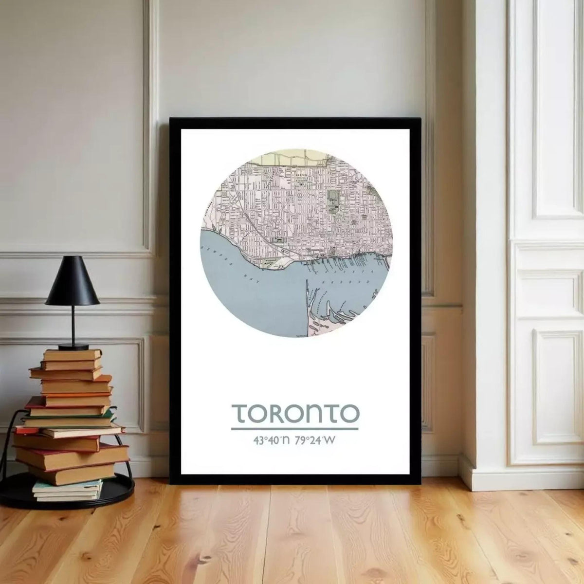 A framed map of Toronto, Canada, with the city's streets and landmarks depicted in a circular format.