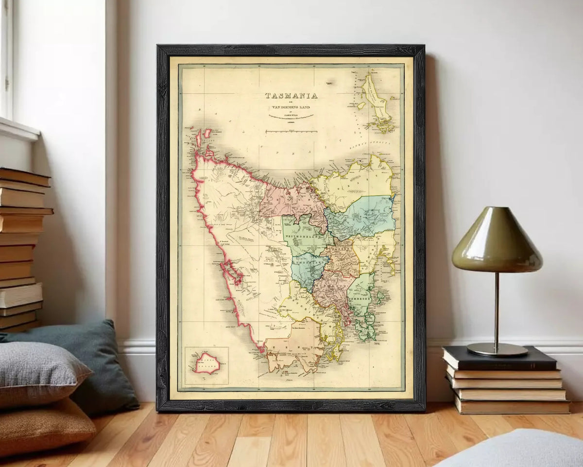 The image is a framed vintage map of Tasmania, Australia, depicting the state's geographical layout and boundaries.