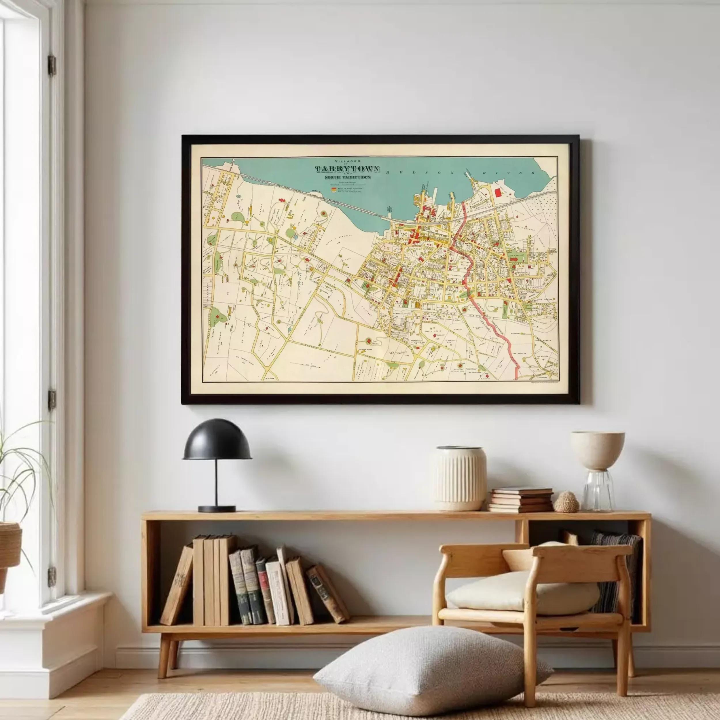 A framed vintage map of Tarrytown, New York, depicting the town's layout and surrounding areas.