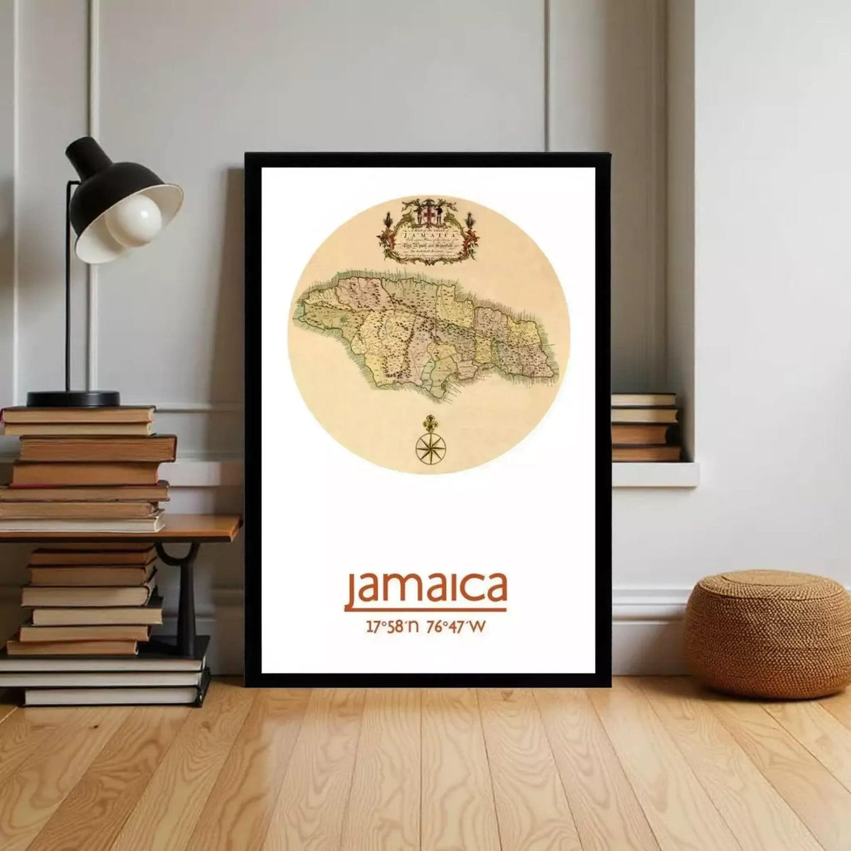 A framed map of Jamaica is displayed on a wall, with a lamp and bookshelf visible in the background.
