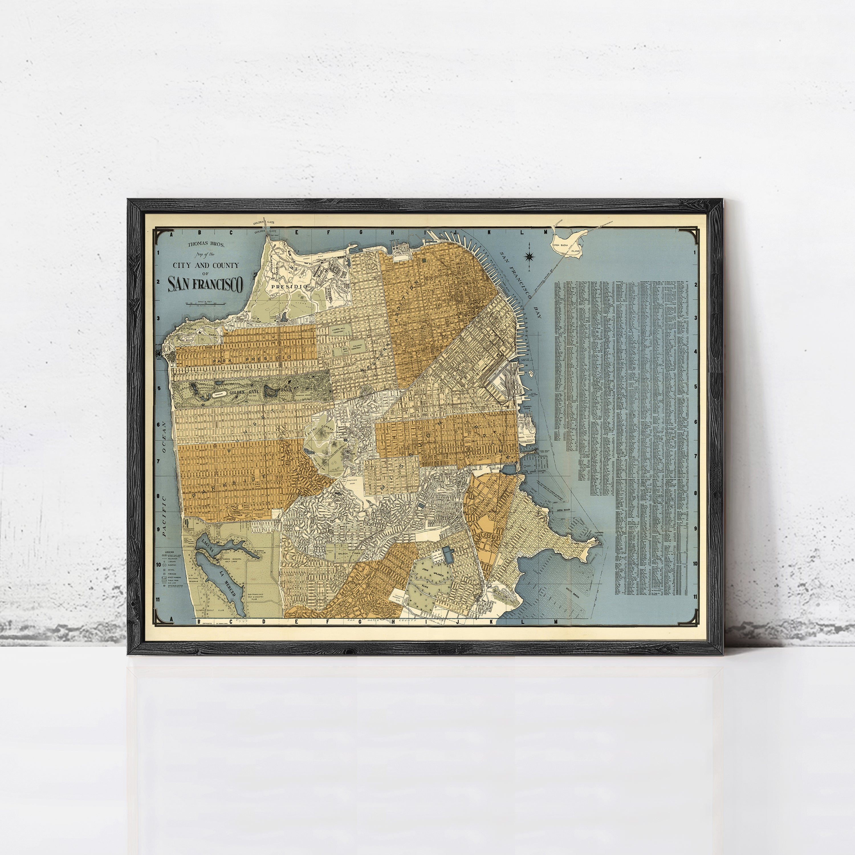 The image is a framed vintage map of San Francisco, California, depicting the city's streets and surrounding areas.