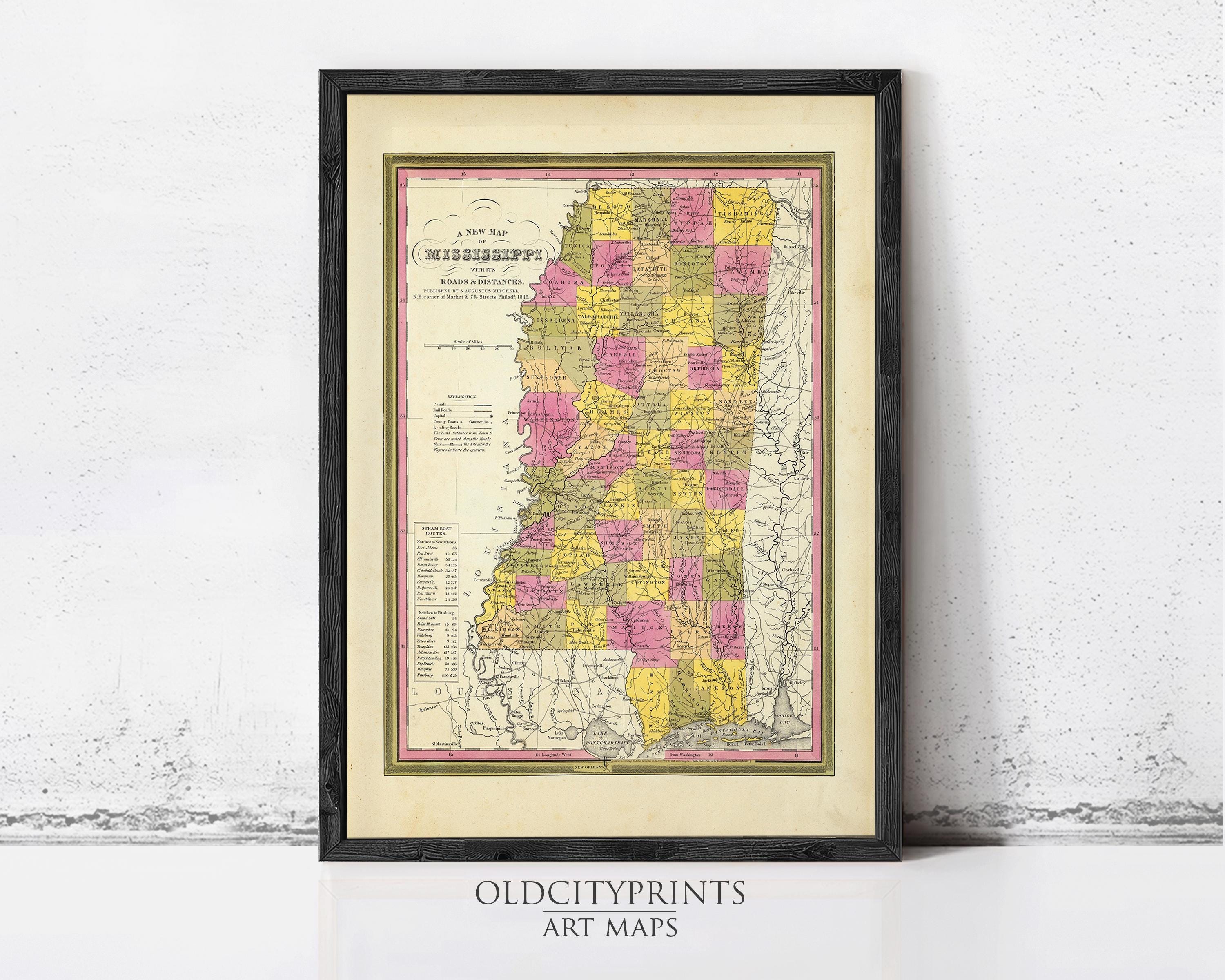 A framed antique map of the state of Mississippi, with a vintage color palette and detailed geographical information.