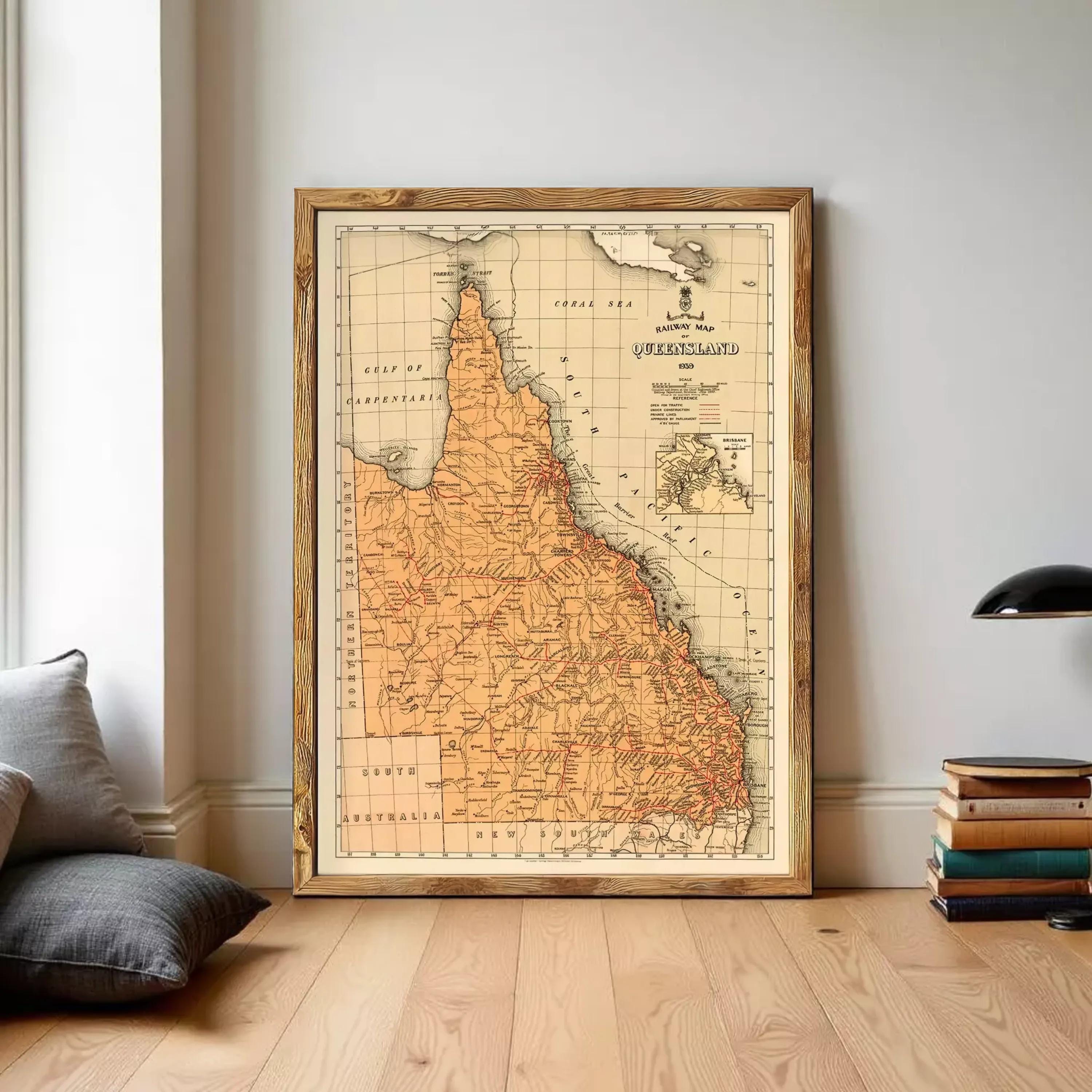 The image is a framed vintage map of the Queensland region of Australia, depicting the state's geographical layout and boundaries.