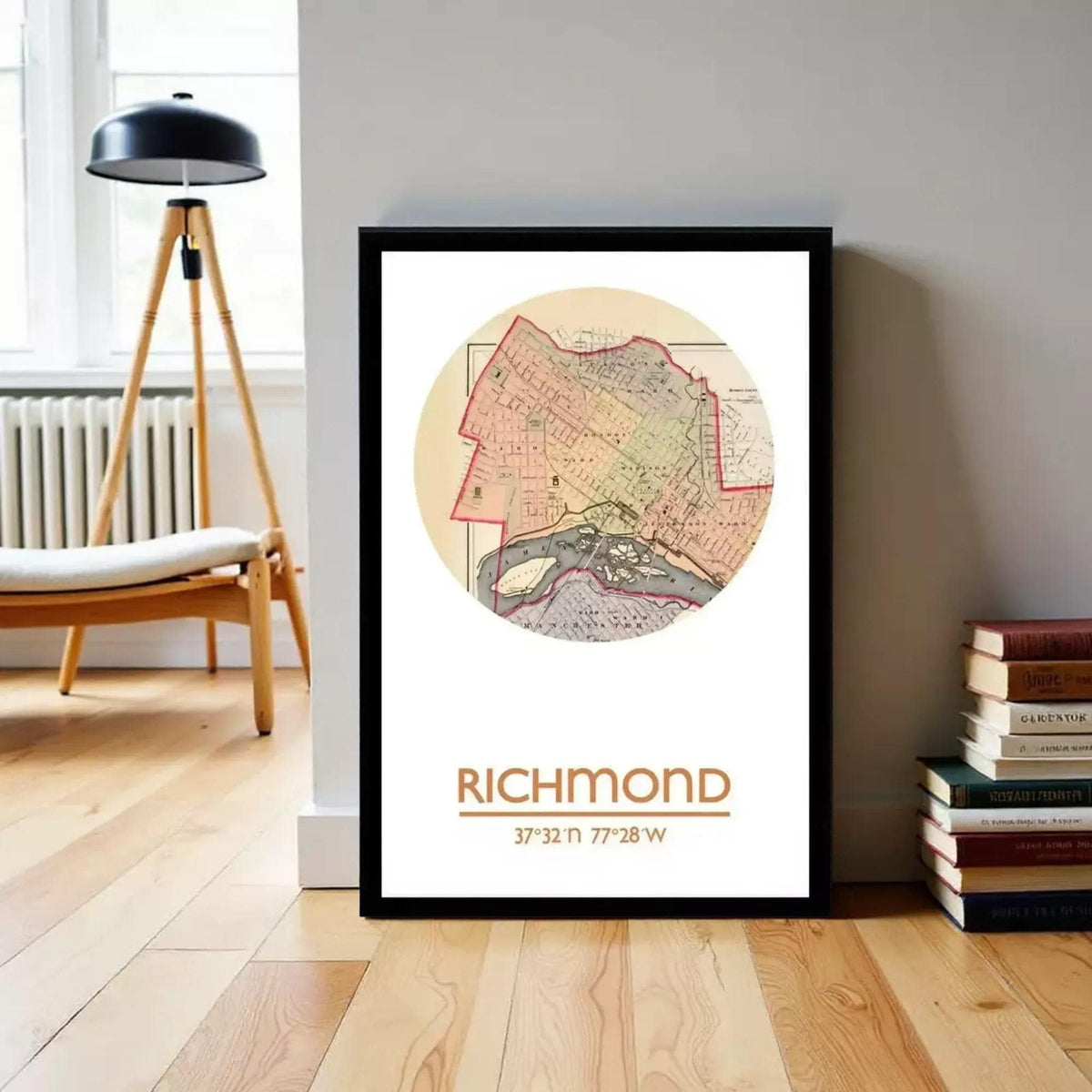 A framed map of Richmond, Virginia, with the city's name and location printed on it, is displayed on a wall in a room with a lamp and bookshelf in the background.