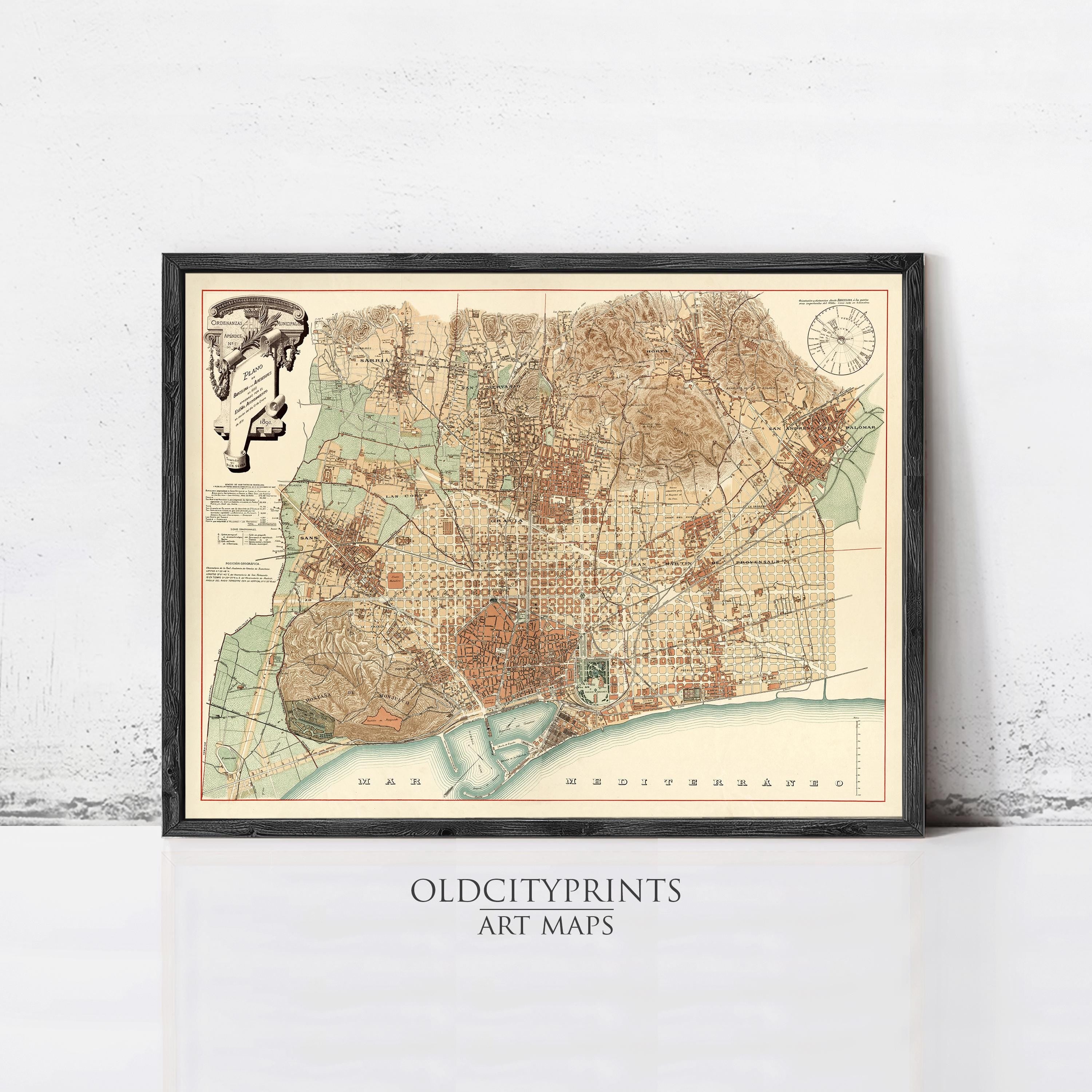 The image is a framed vintage map of a city, likely from the past, displayed on a wall.