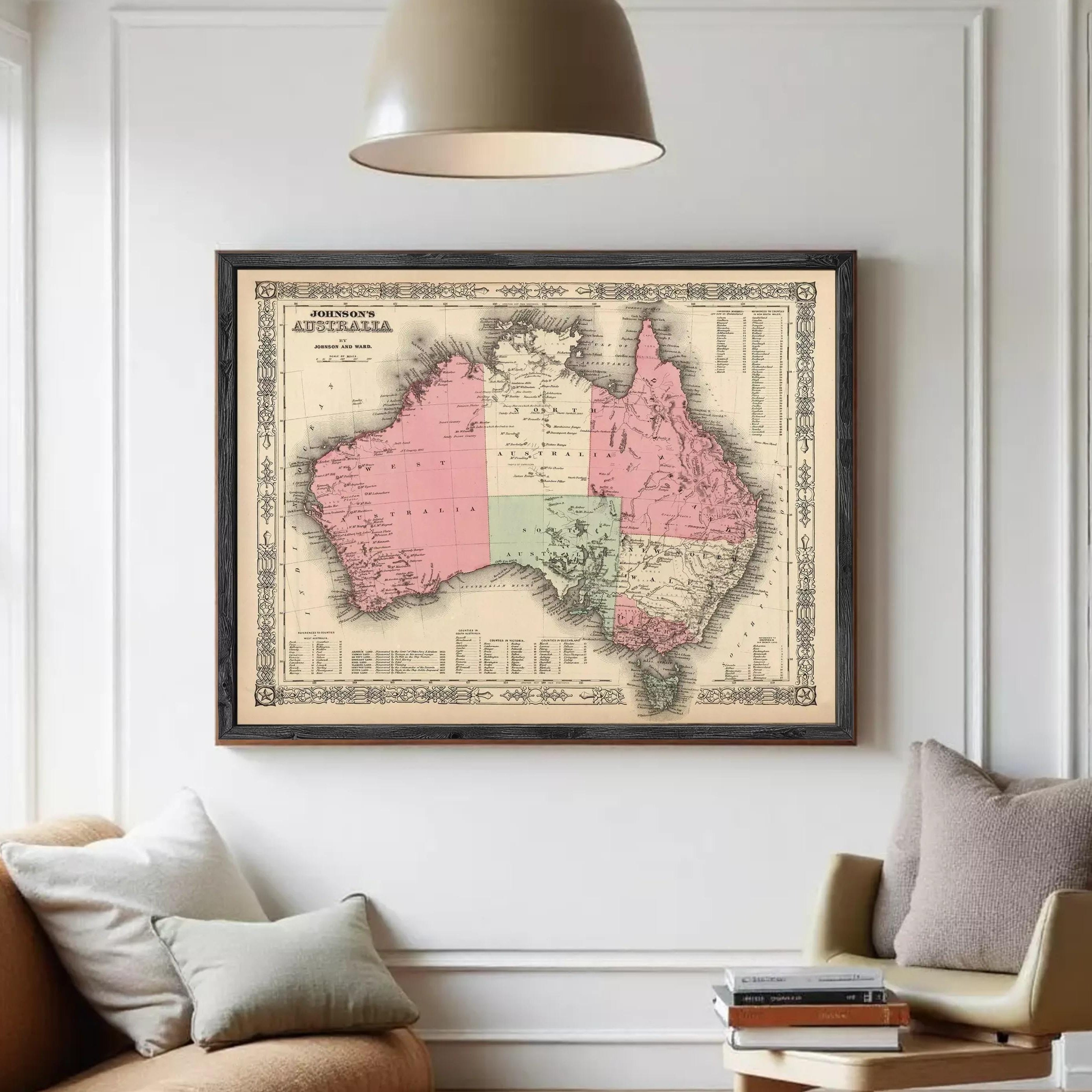 The image is a framed vintage map of Australia, depicting the country in a detailed and intricate manner.
