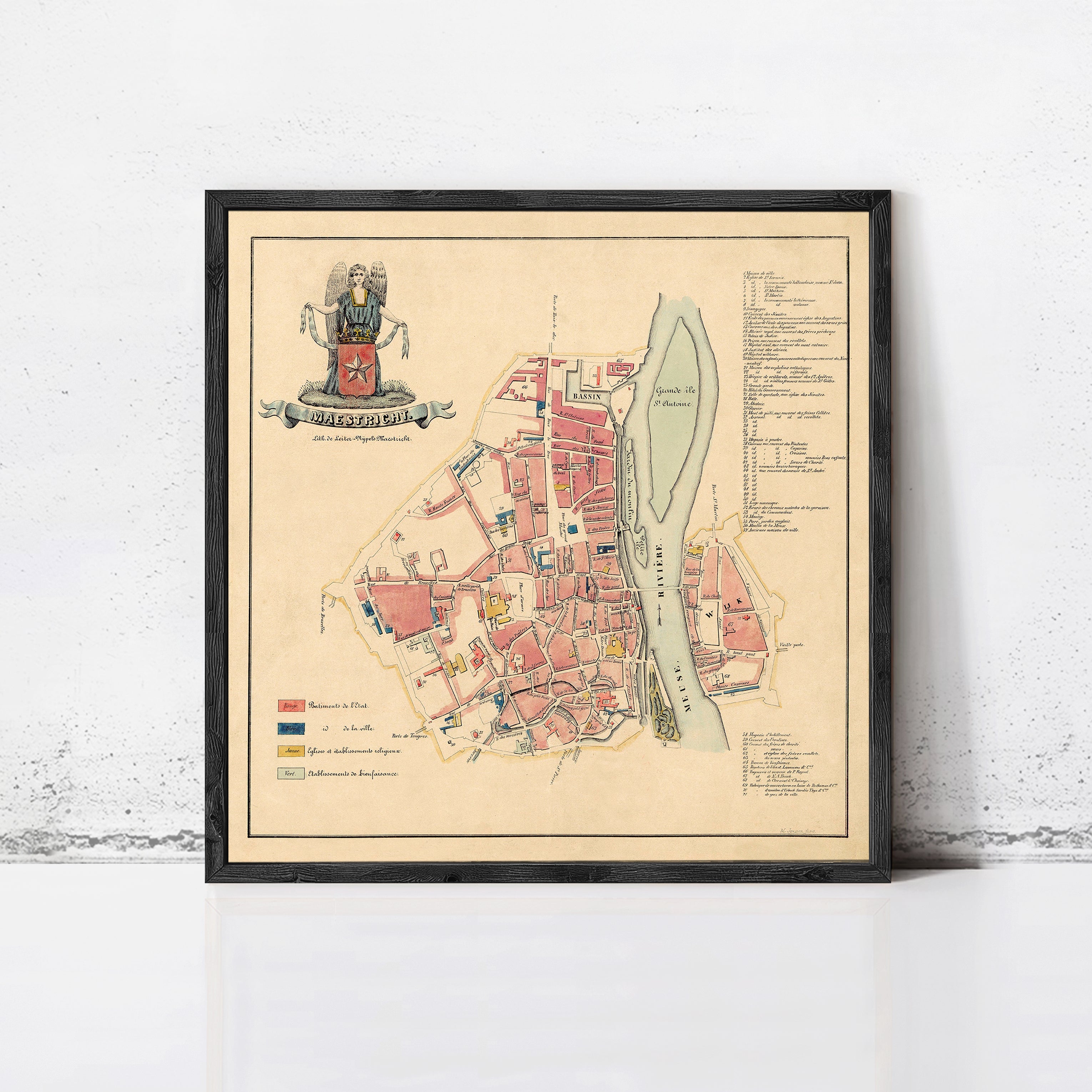 The image is a framed map of a city, likely from the Middle Ages, with a coat of arms and various labels indicating different locations and landmarks within the city.